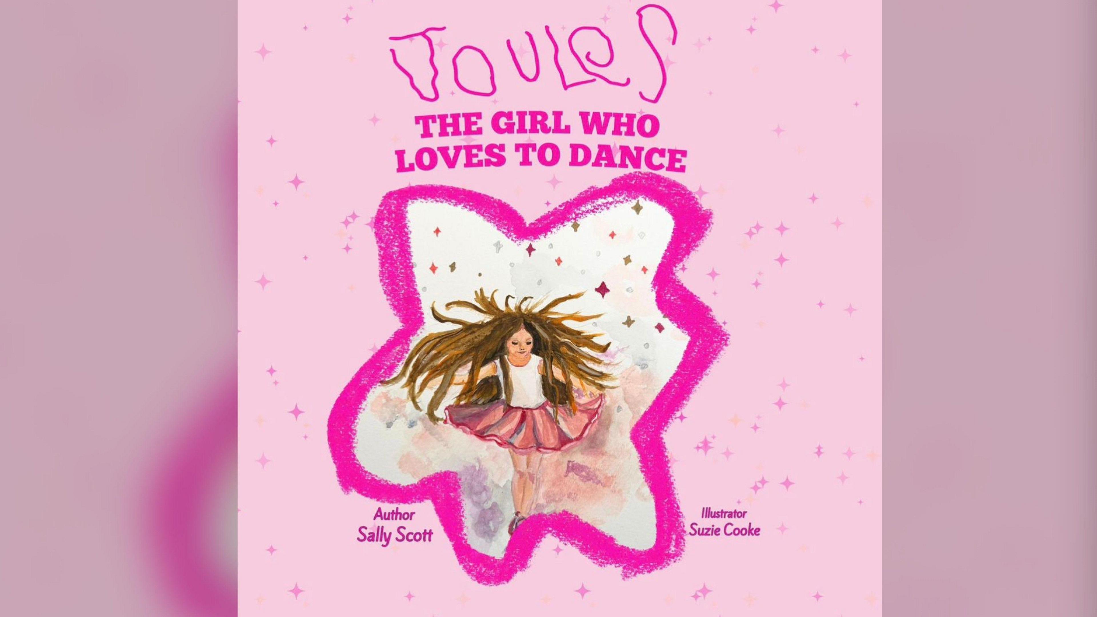 The front cover image of the book. It is light pink with pink stars and pink lettering saying 'Joules the girl who loves to dance'. In the centre of the image is the character of a young girl with ling brown hair wearing a tutu. 