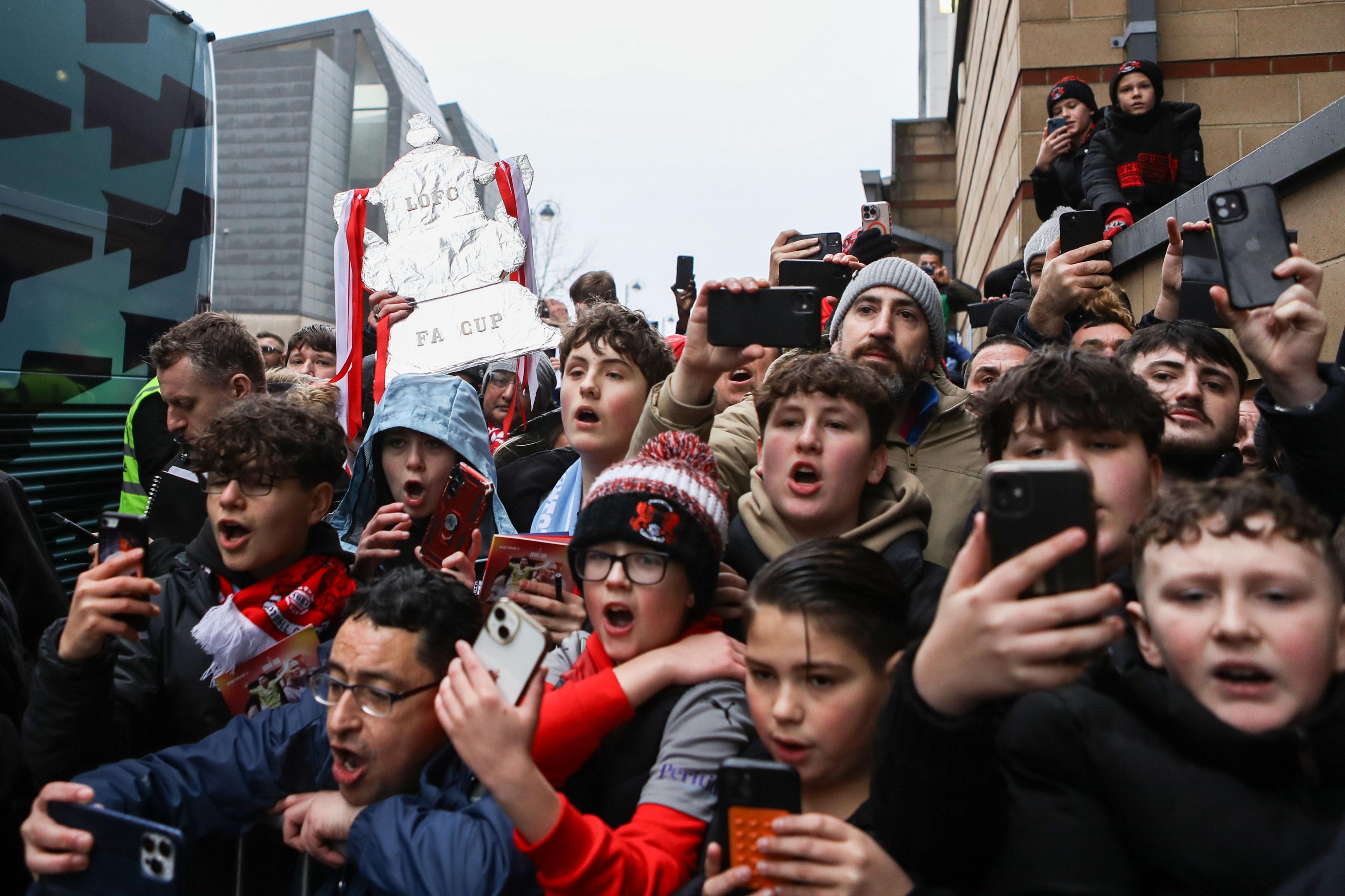 Young Orient fans react as the Manchester City players walk off the bus during the Emirates FA Cup Fourth Round match between Leyton Orient and Manchester City at Gaughan Group Stadium