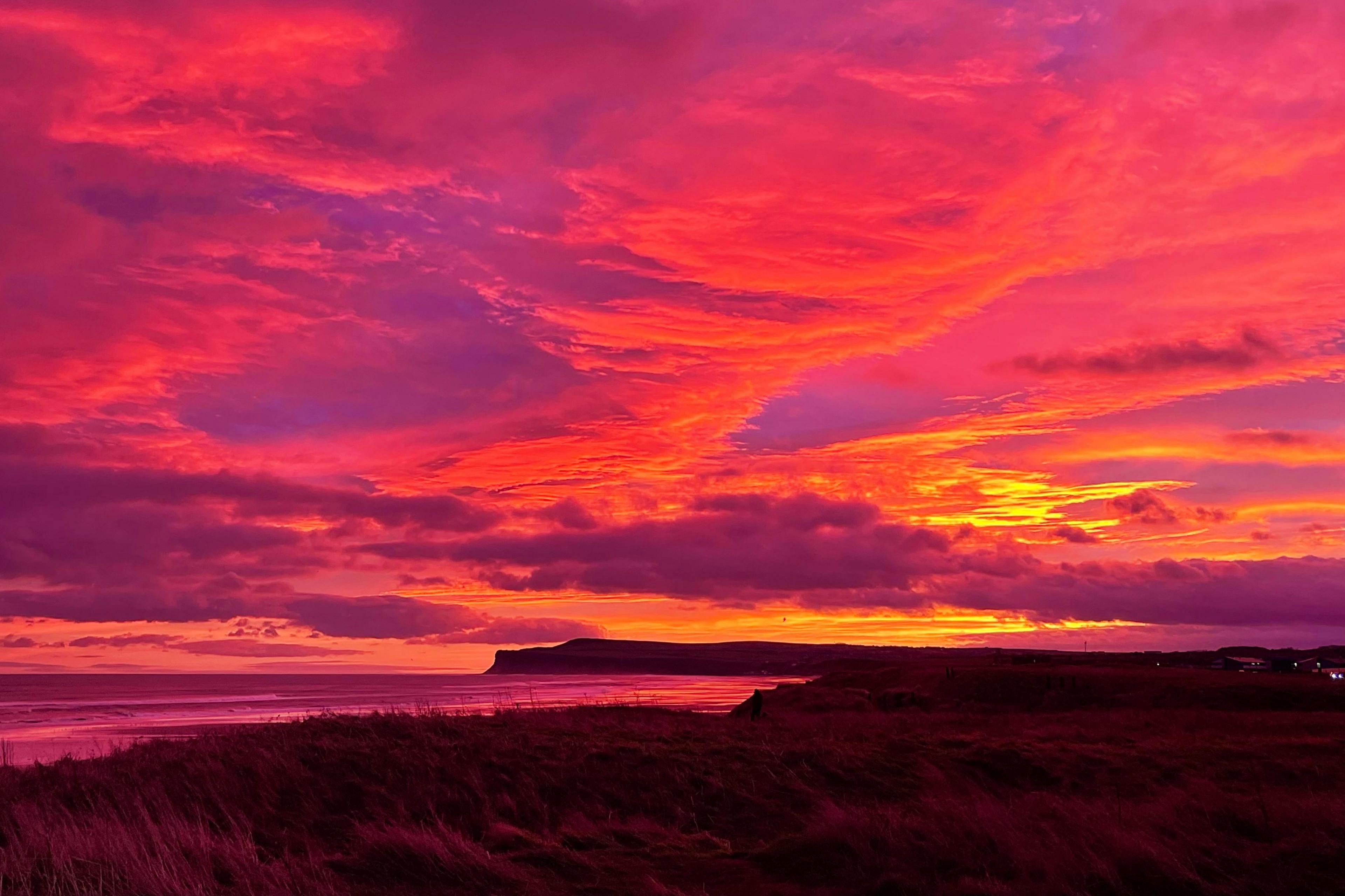 The clouds appear pink above the Marske-by-the-Sea coast.