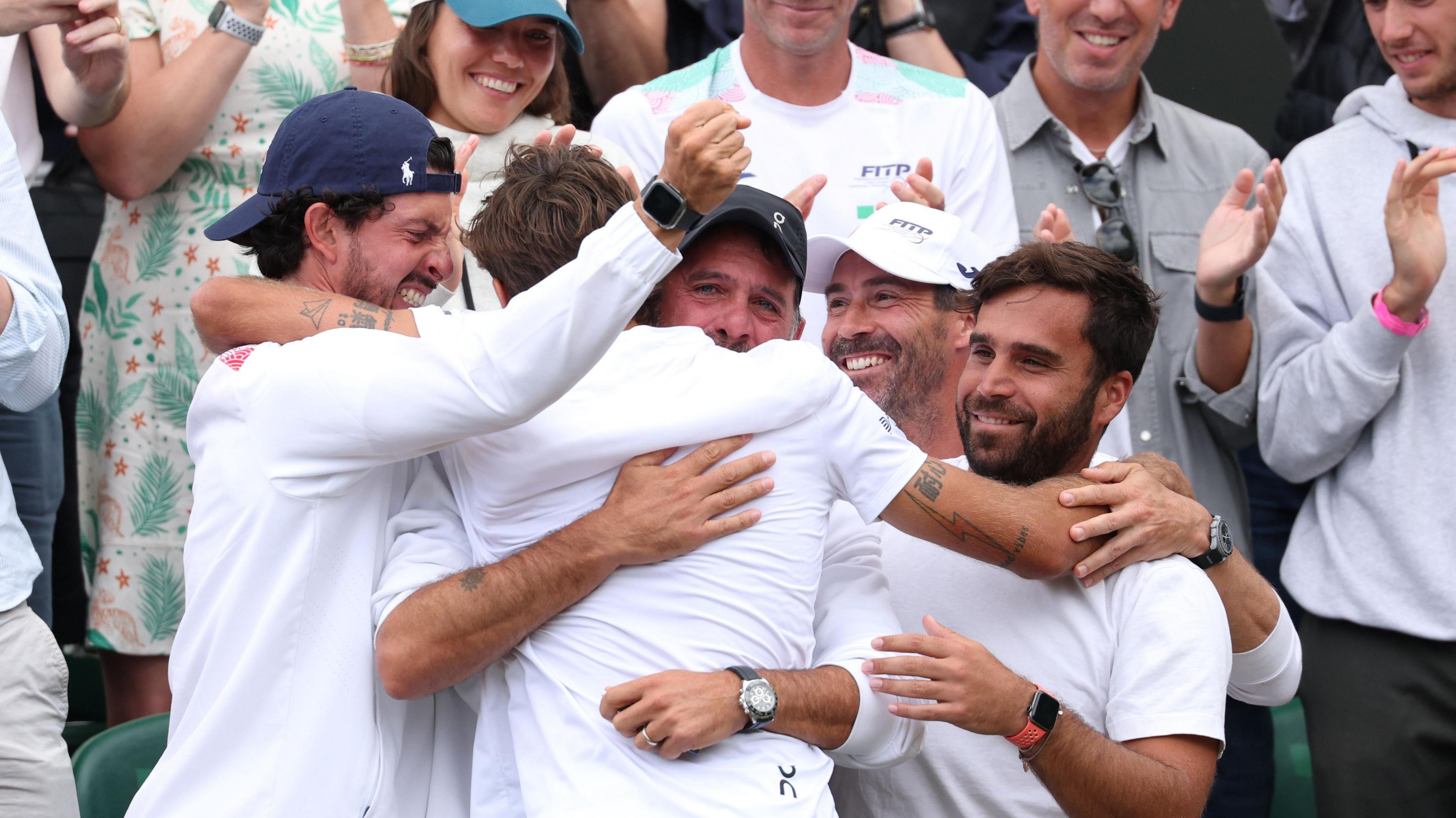 Flavio Cobolli celebrates his fourth-round win at Wimbledon with his family on court two