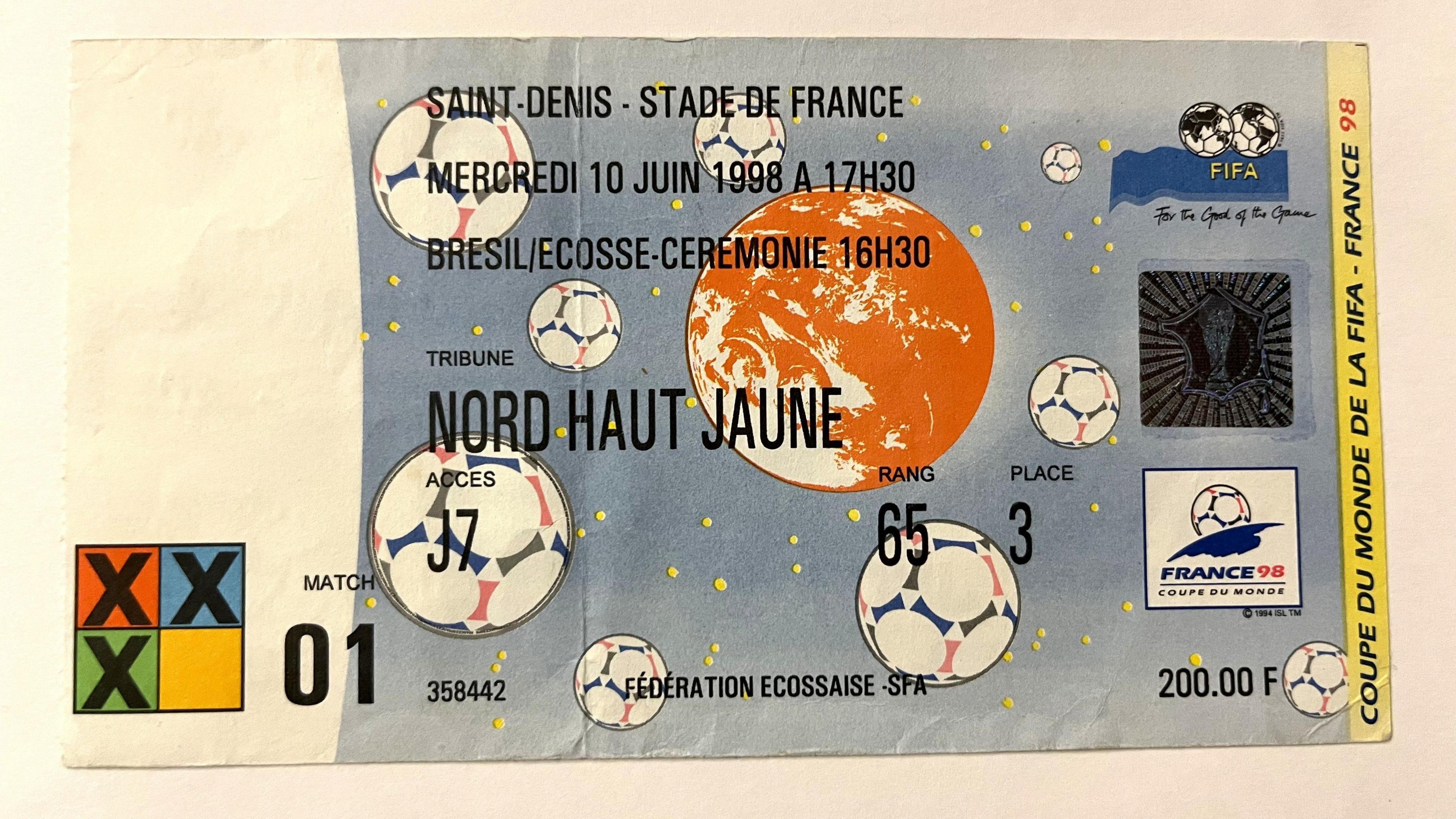 This image shows a ticket for the 1998 FIFA World Cup held in France. It is for the opening match between Brazil and Scotland at Stade de France, Saint-Denis, on Wednesday, 10 June, 1998, at 17:30.