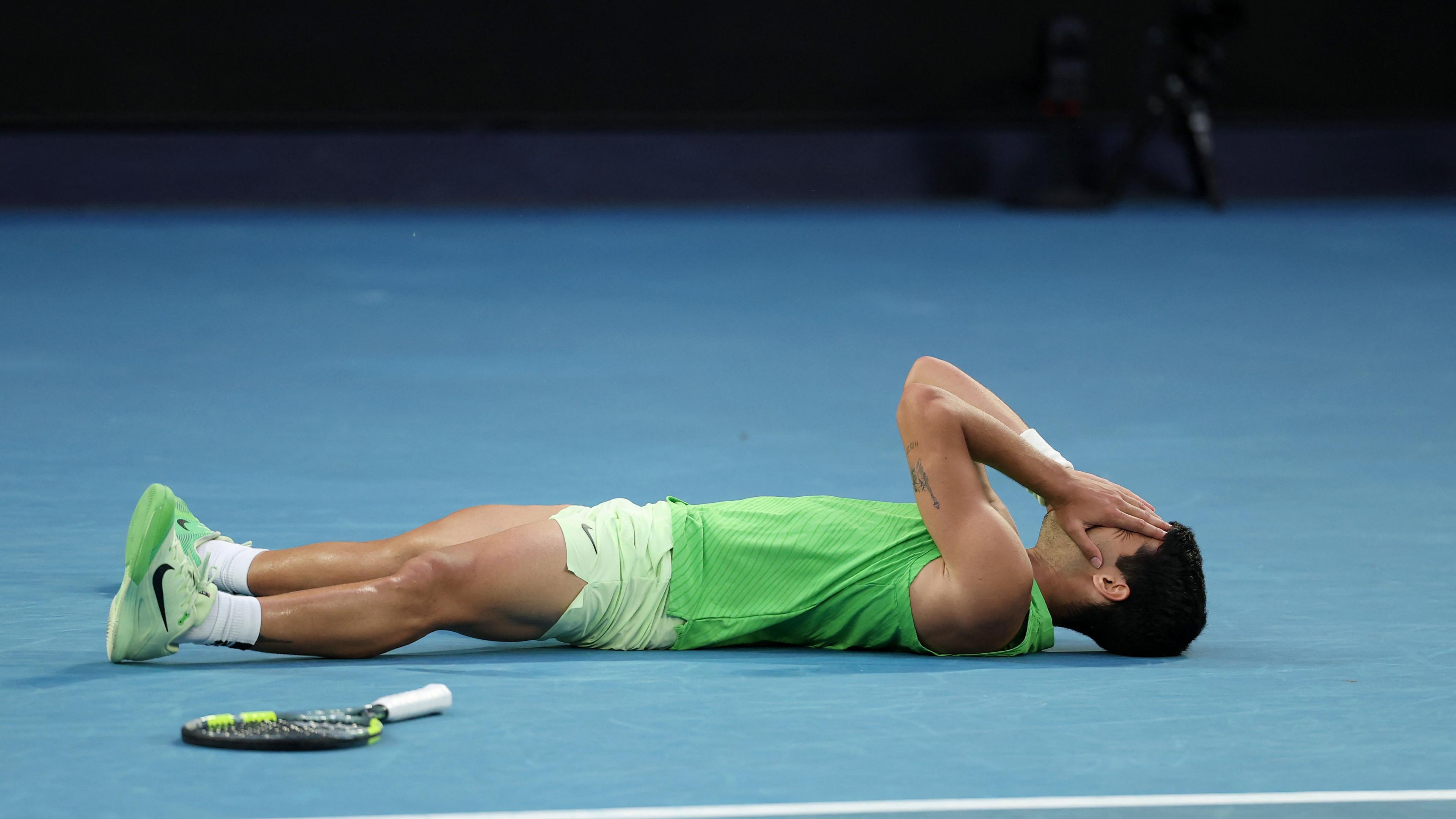 Carlos Alcaraz on the floor after his epic win