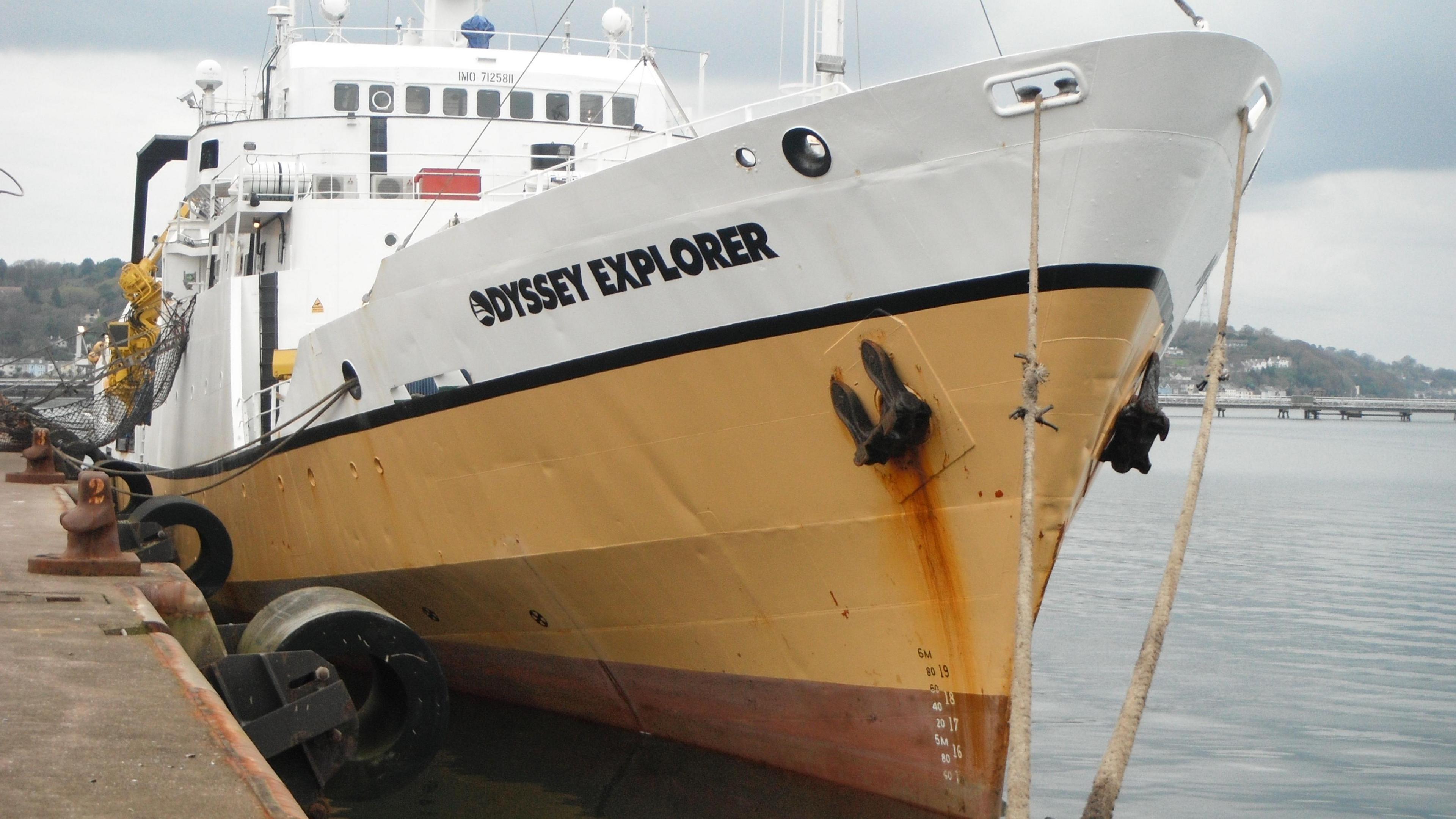 A picture of a trawler moored up with the name Odyssey Explorer clearly visible in the foreground 