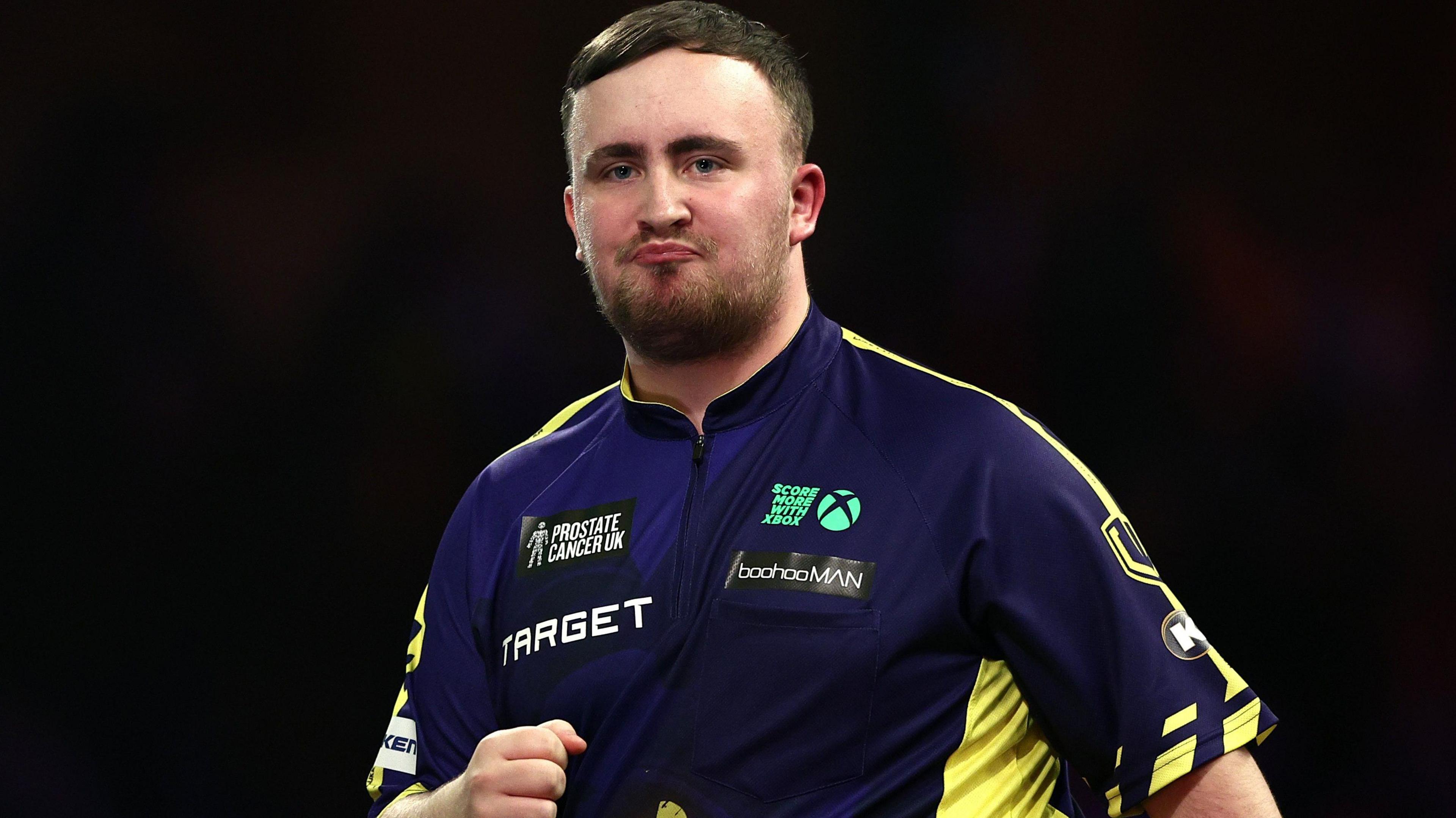 Luke Littler purses his lips during the PDC World Championship