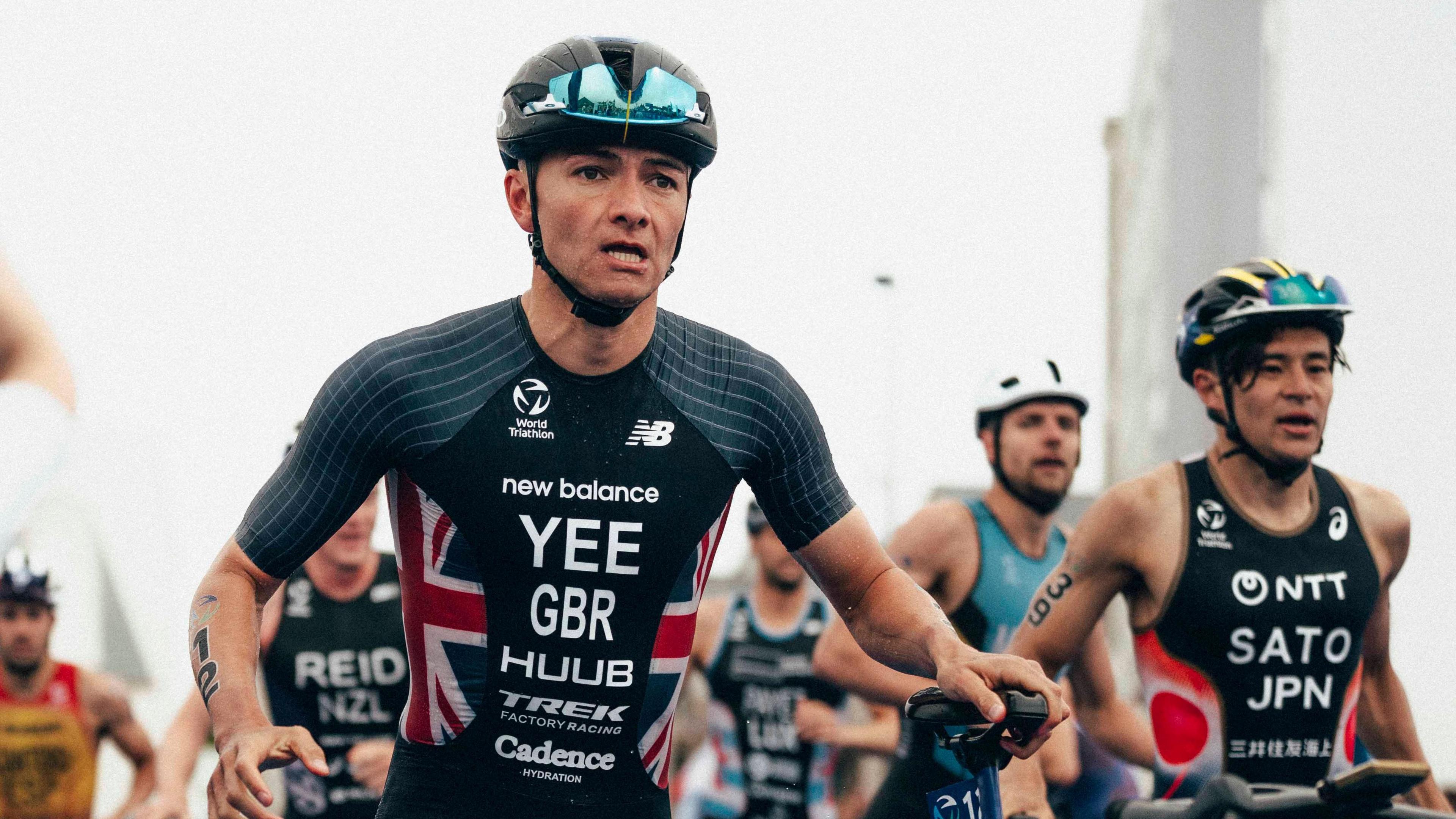 Alex Yee leaving transition with his bike