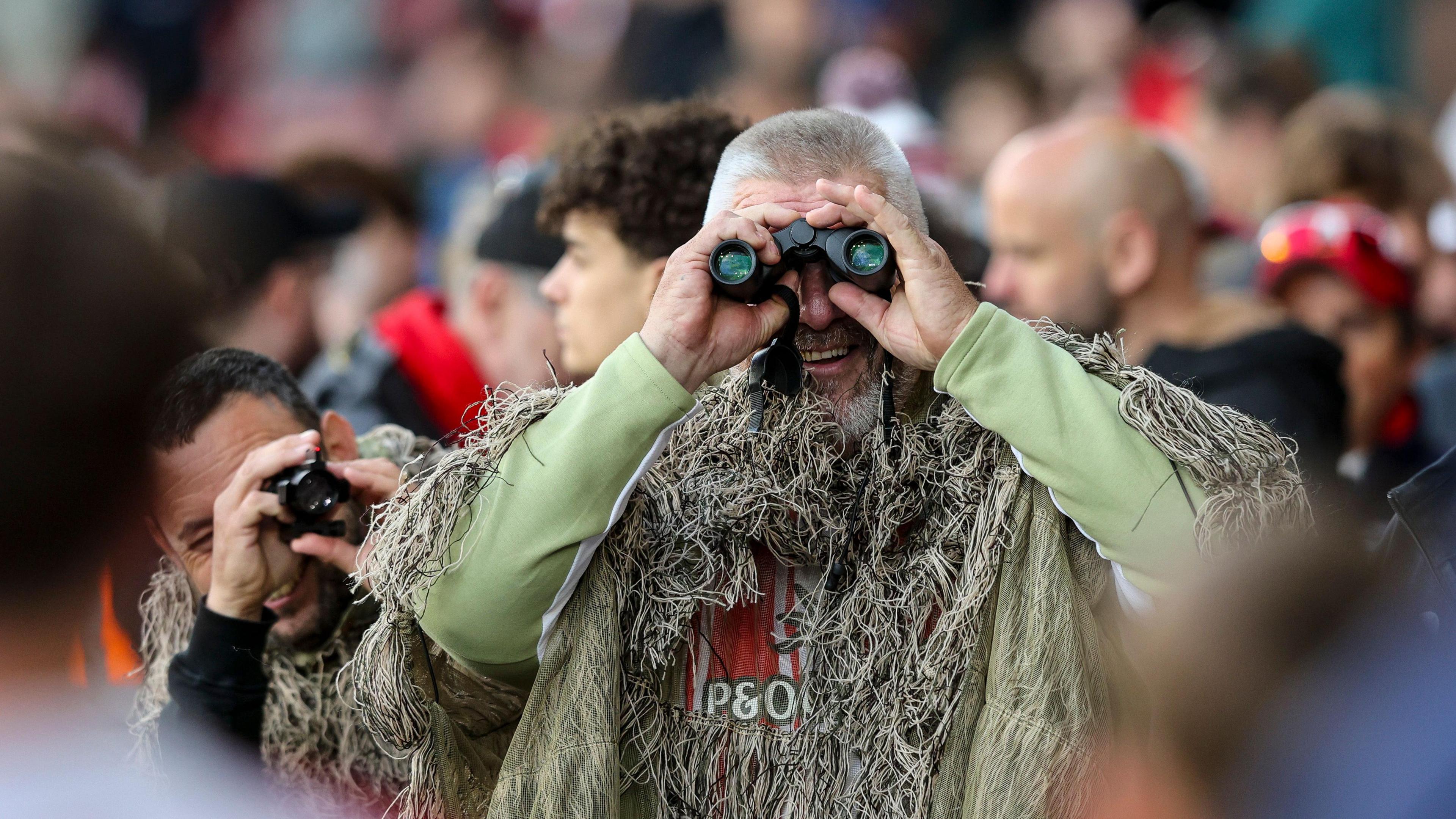 A Southampton fan in camouflage attire during the second leg of his side's Championship semi-final against Middlesbrough