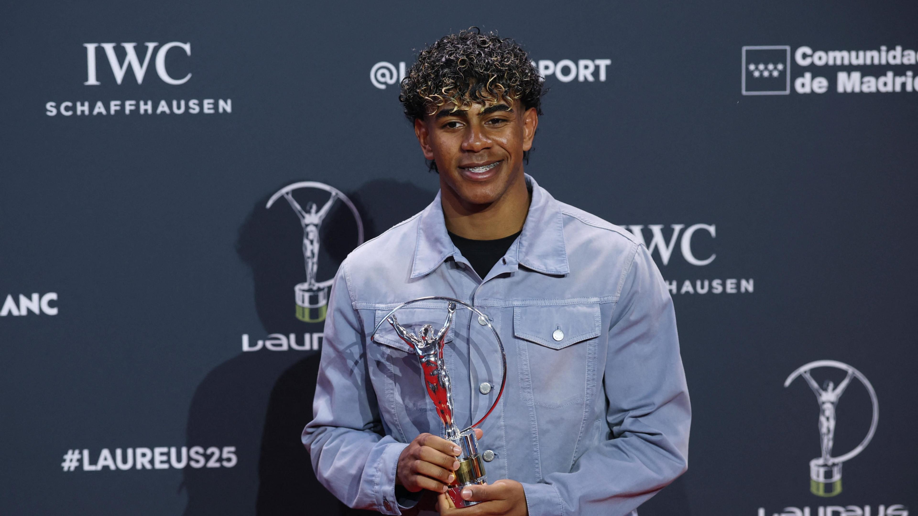 Spain's Lamine Yamal poses after winning the World Young Sportsperson of the Year Award on the red carpet. 
