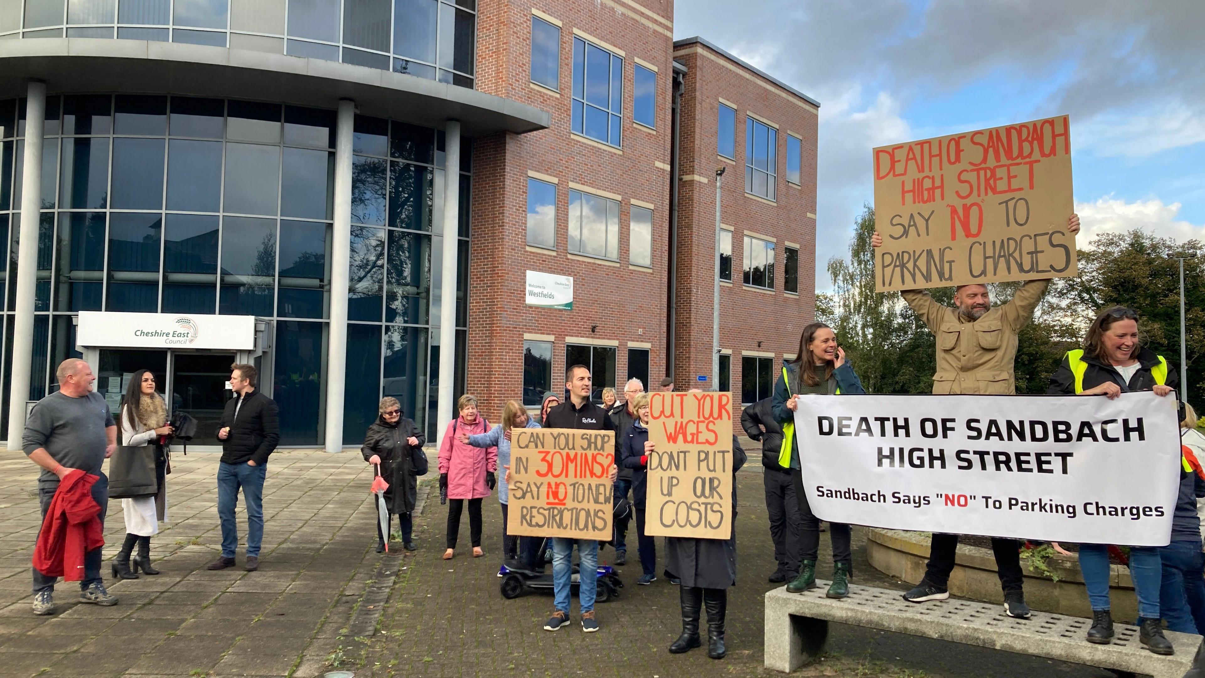 Protestors from Sandbach outside Cheshire East Council's headquarters