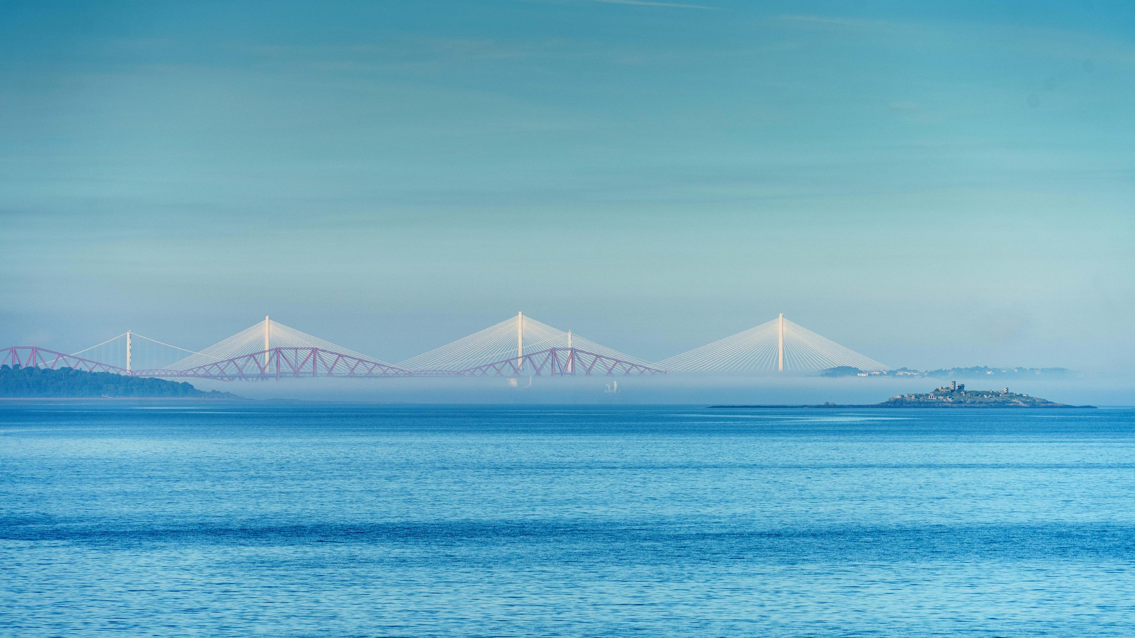 This picture is different shades of blue. Across the middle are the three bridges.