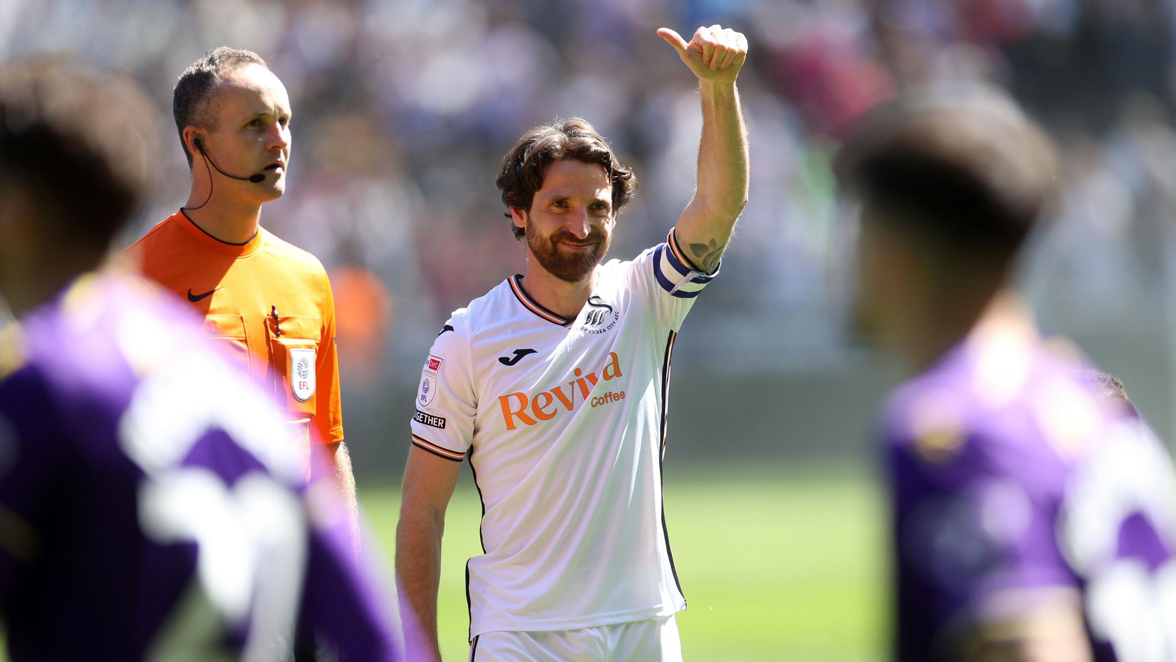 Joe Allen acknowledges the fans