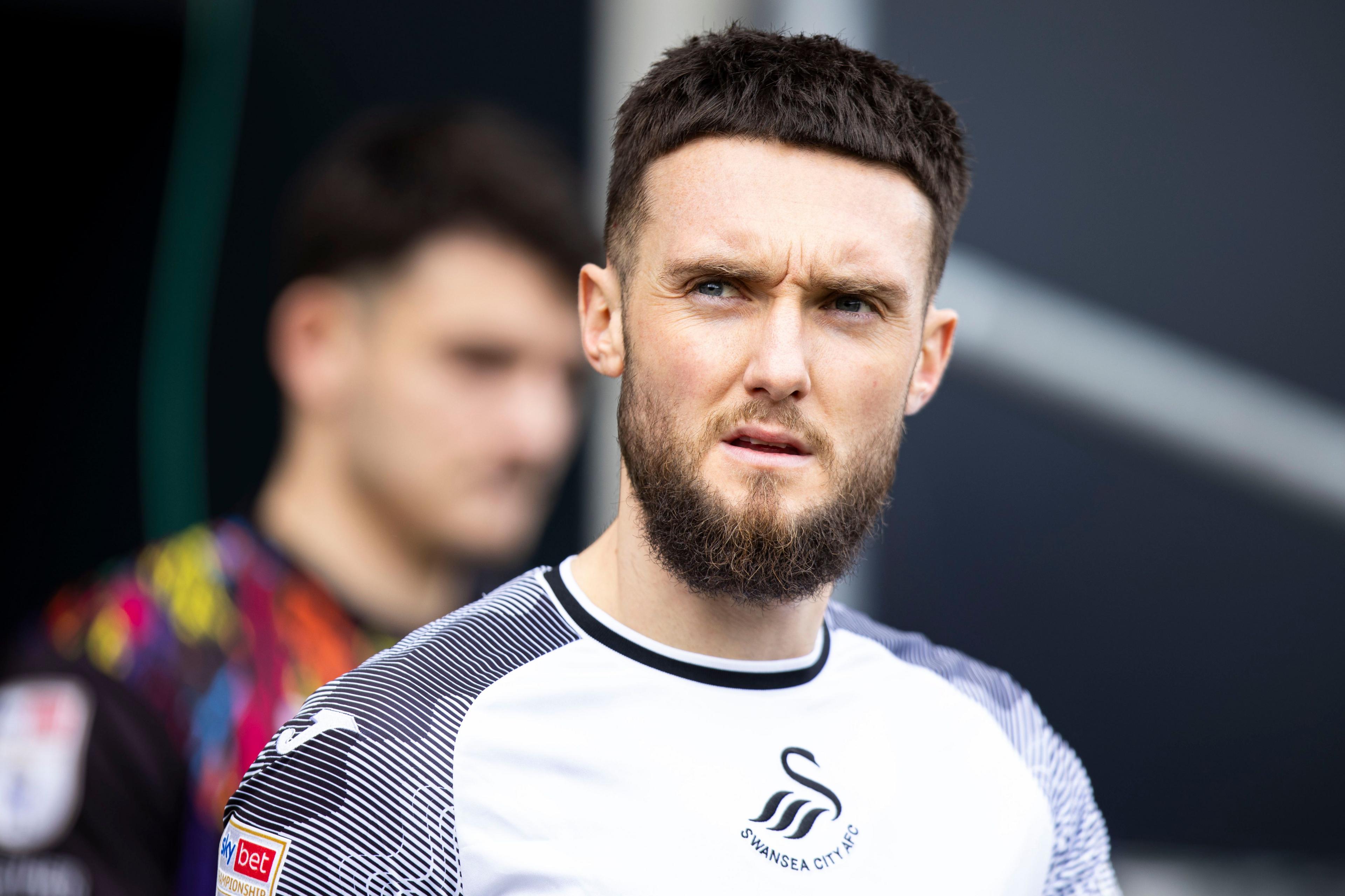 Matt Grimes leads out Swansea City