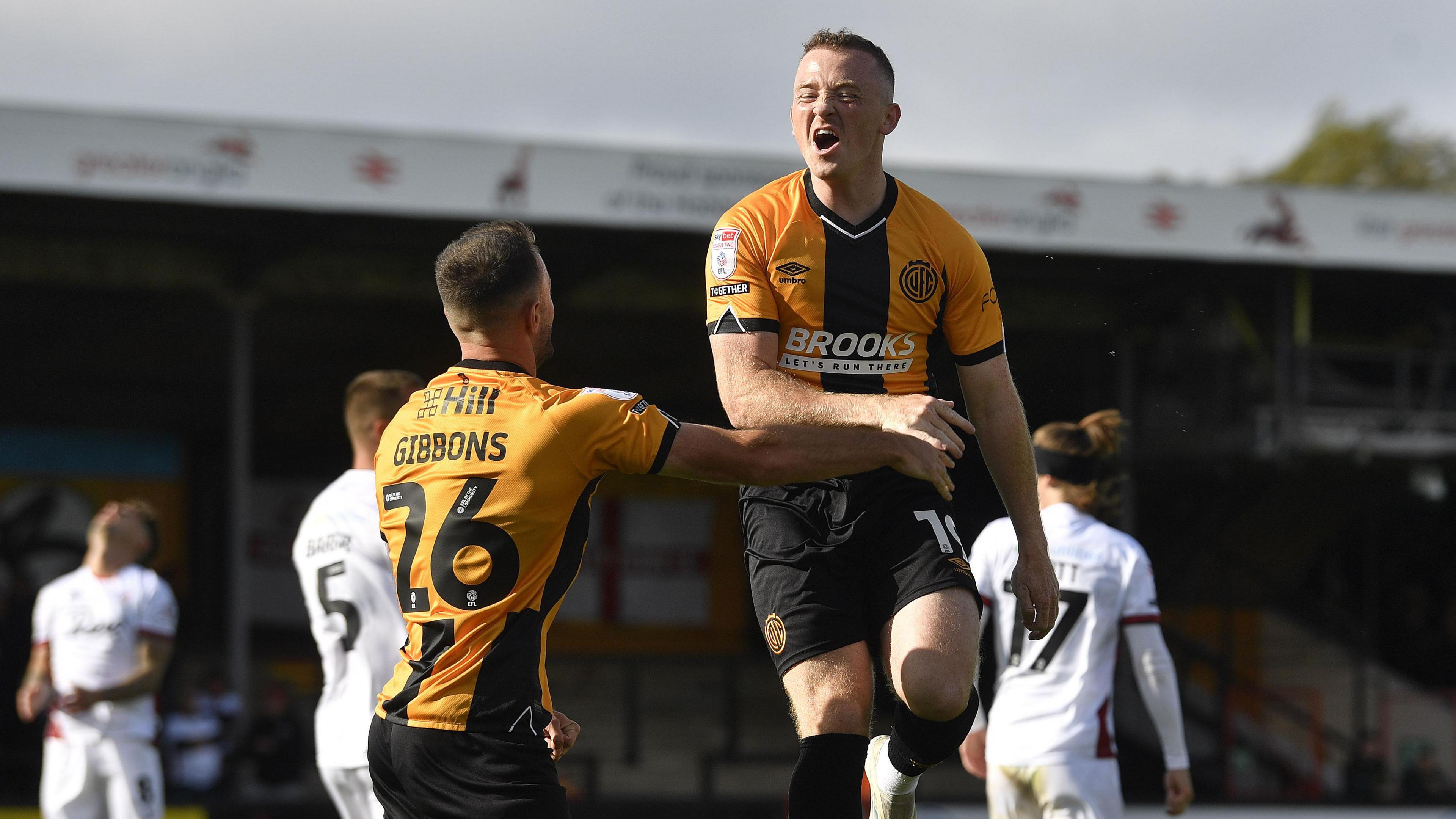 Shayne Lavery jumps in the air towards team-mate James Gibbons