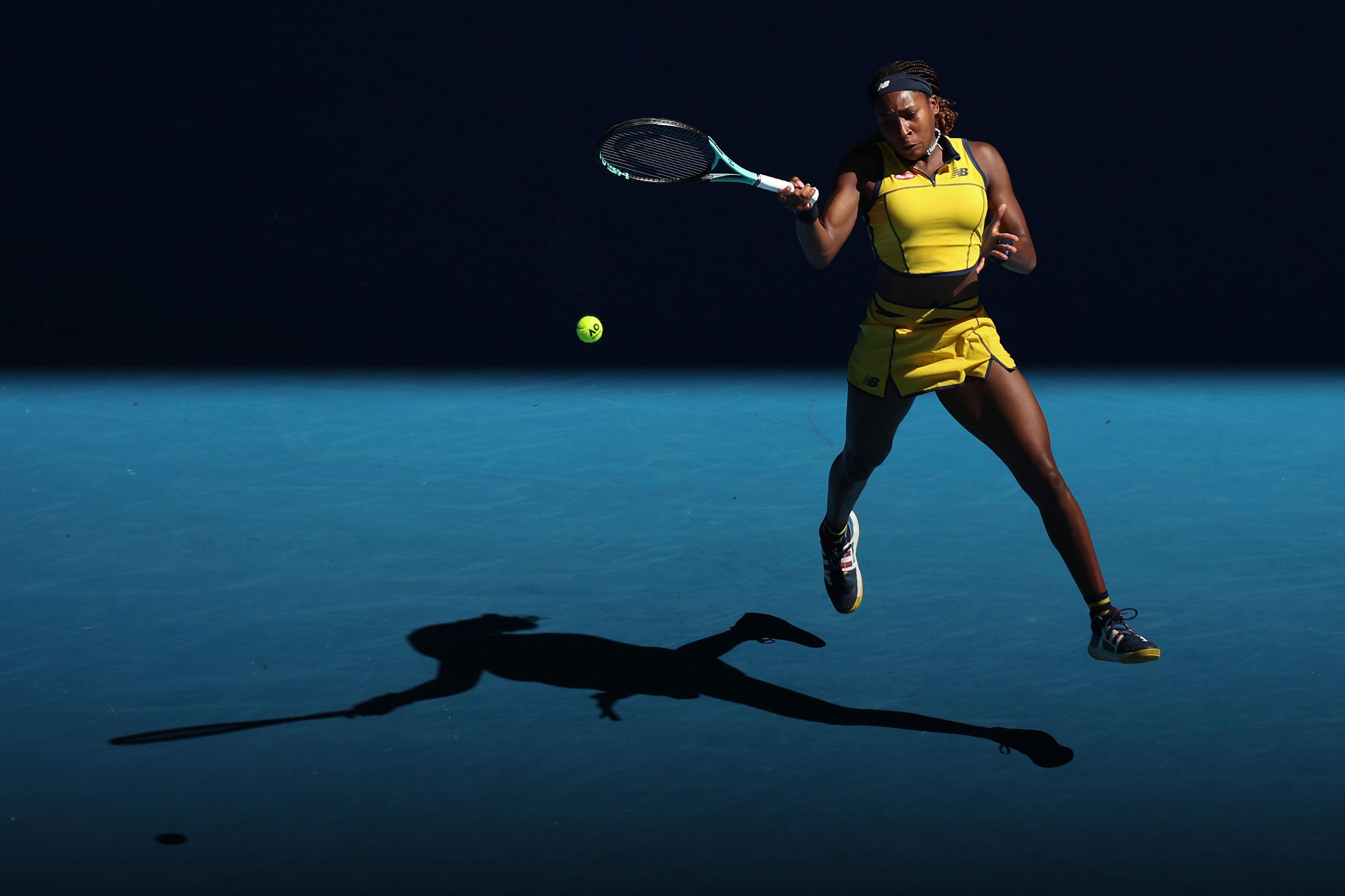 Coco Gauff of the United States plays a forehand in their quarterfinals singles match against Marta Kostyuk of Ukraine during the 2024 Australian Open at Melbourne Park on January 23, 2024 in Melbourne, Australia