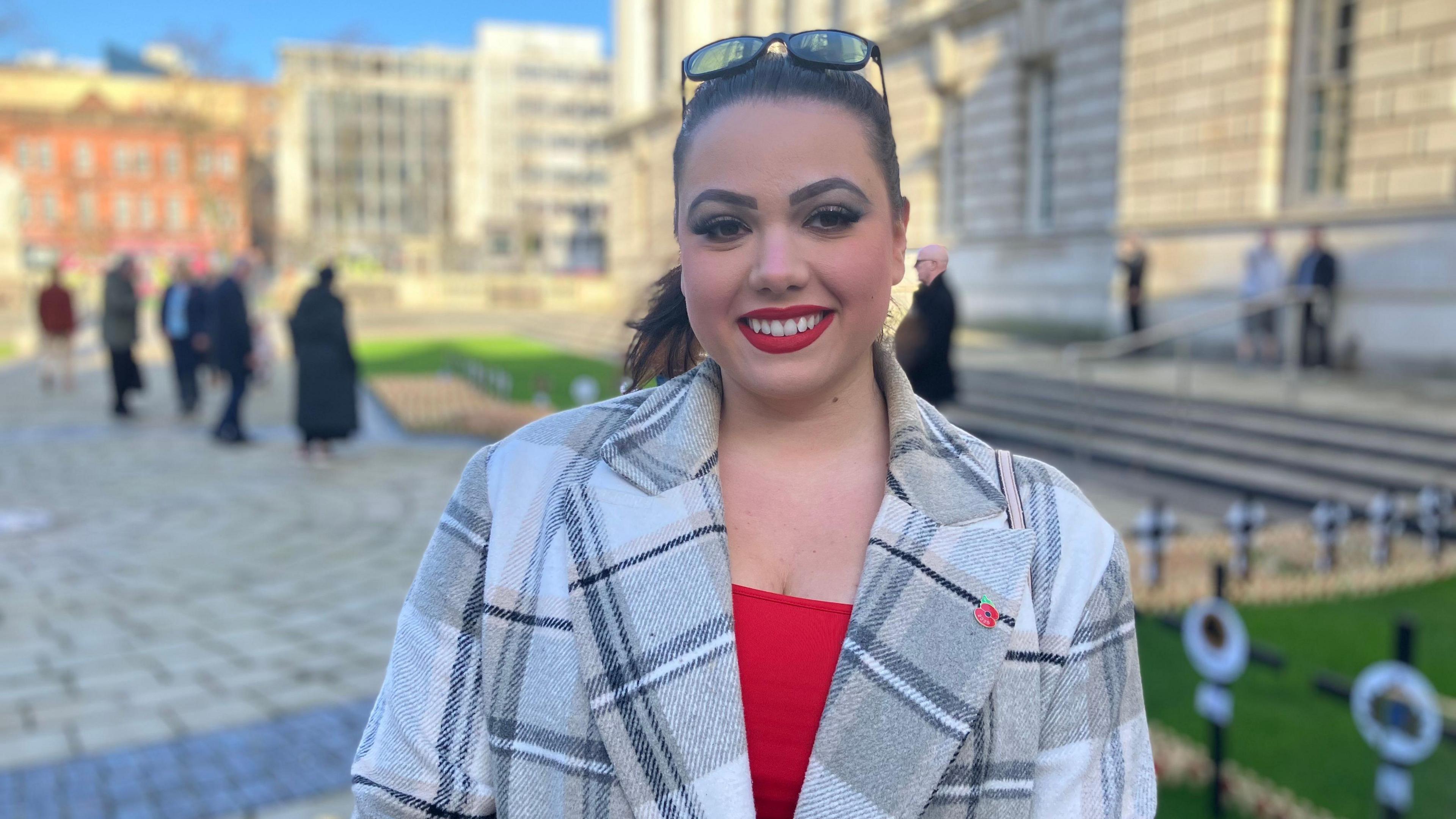 A woman with dark hair tied up
