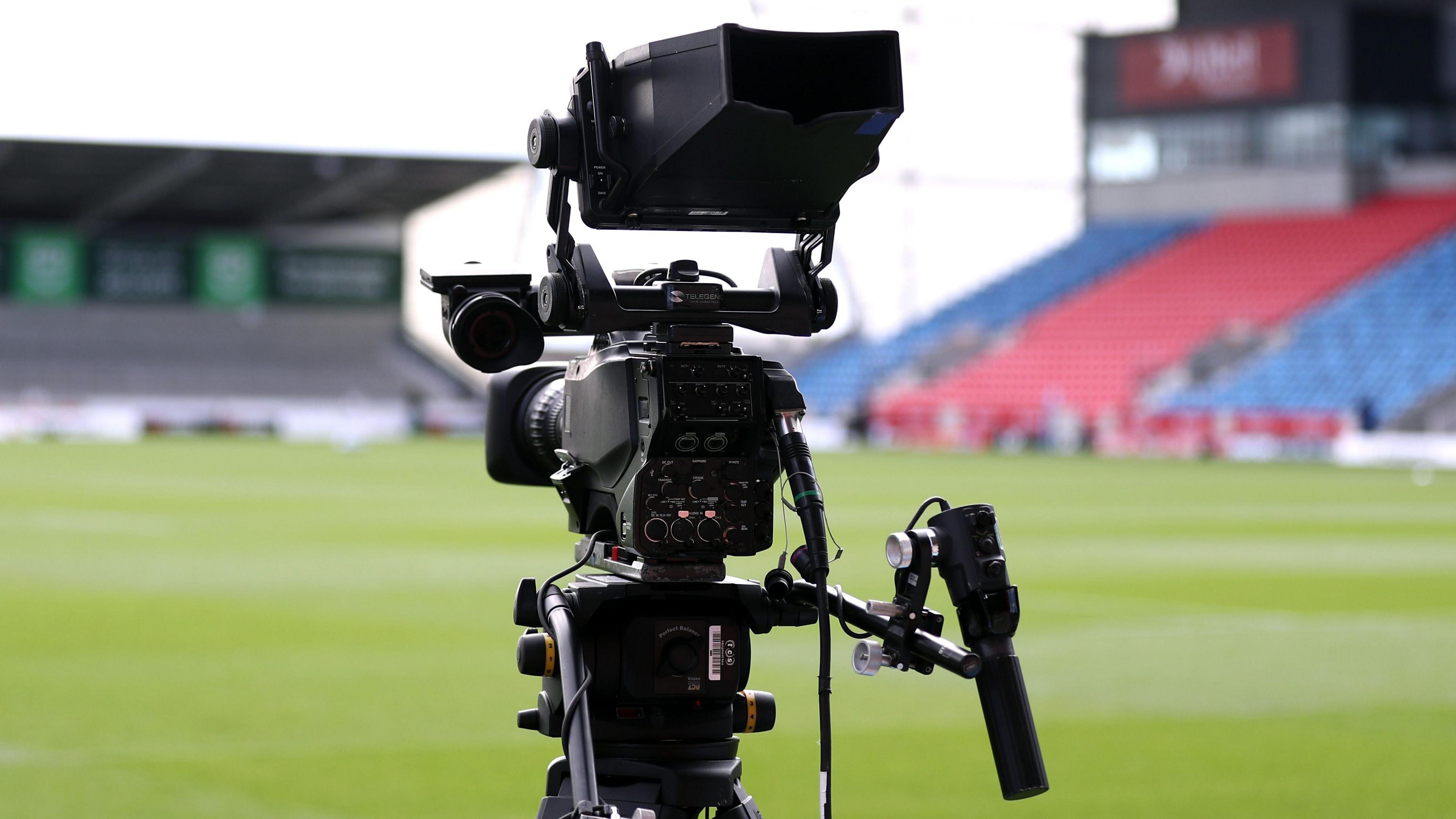 A TV camera pitchside at Sale Sharks' AJ Bell Stadium