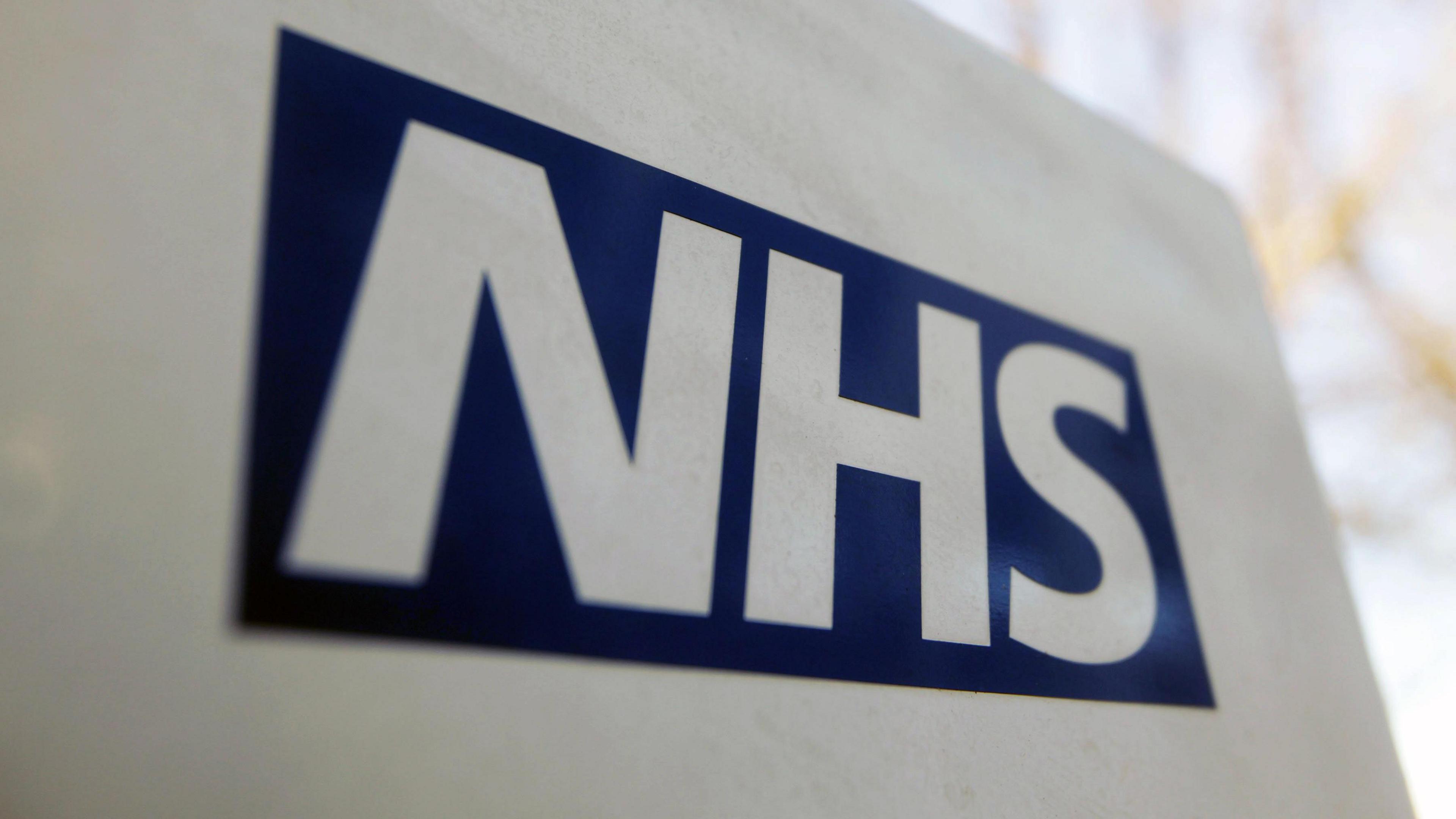 An image of the NHS logo 