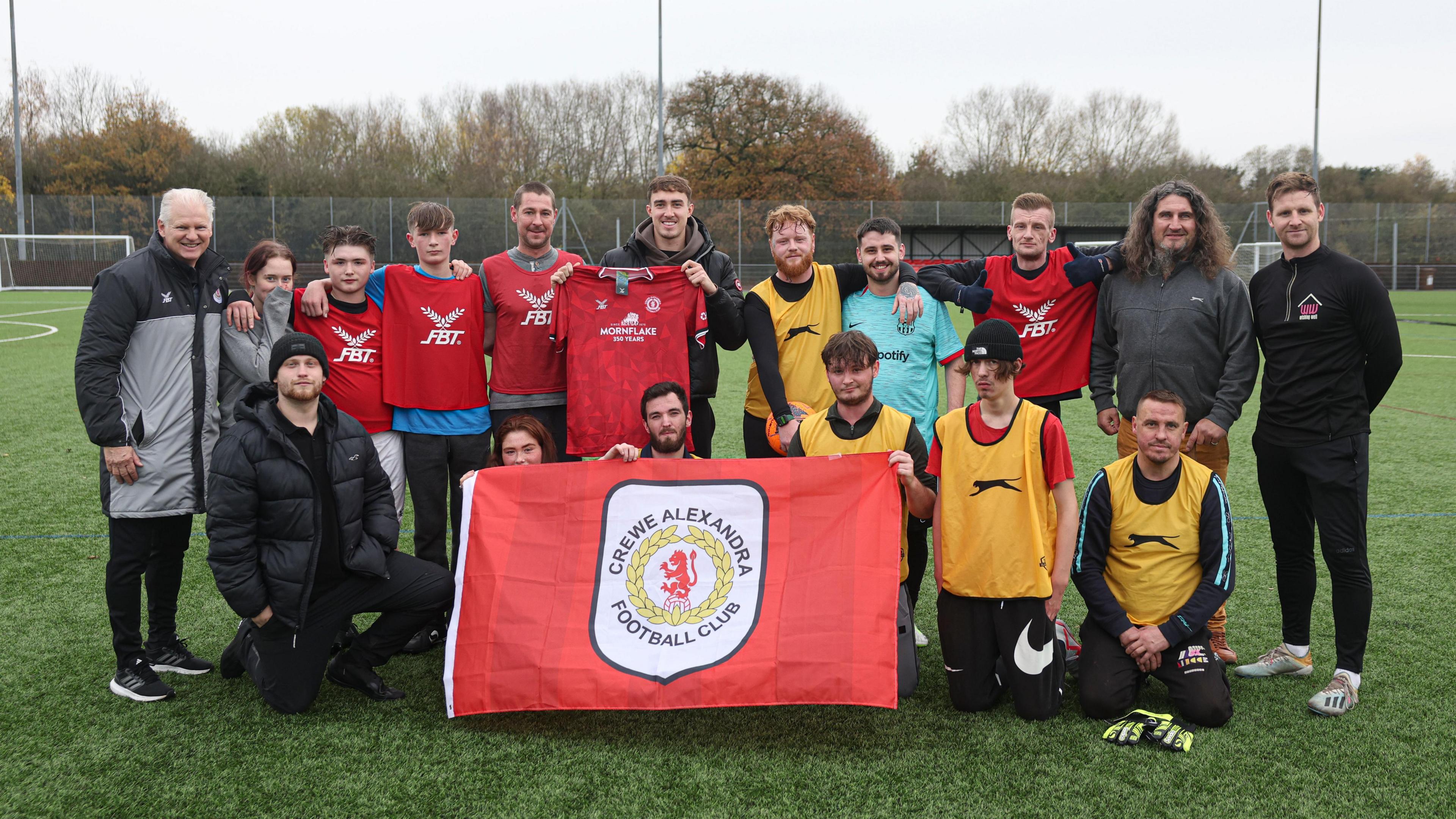 Crewe's Lewis Billington joins a homeless football session run by the club's community trust