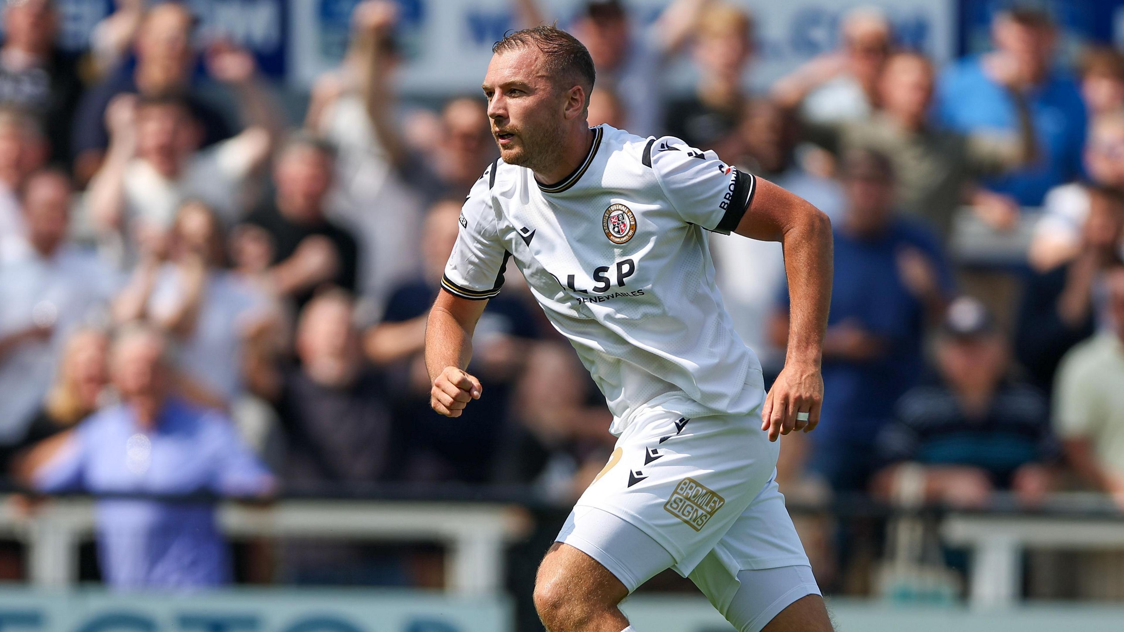 Michael Cheek celebrates scoring against AFC Wimbledon