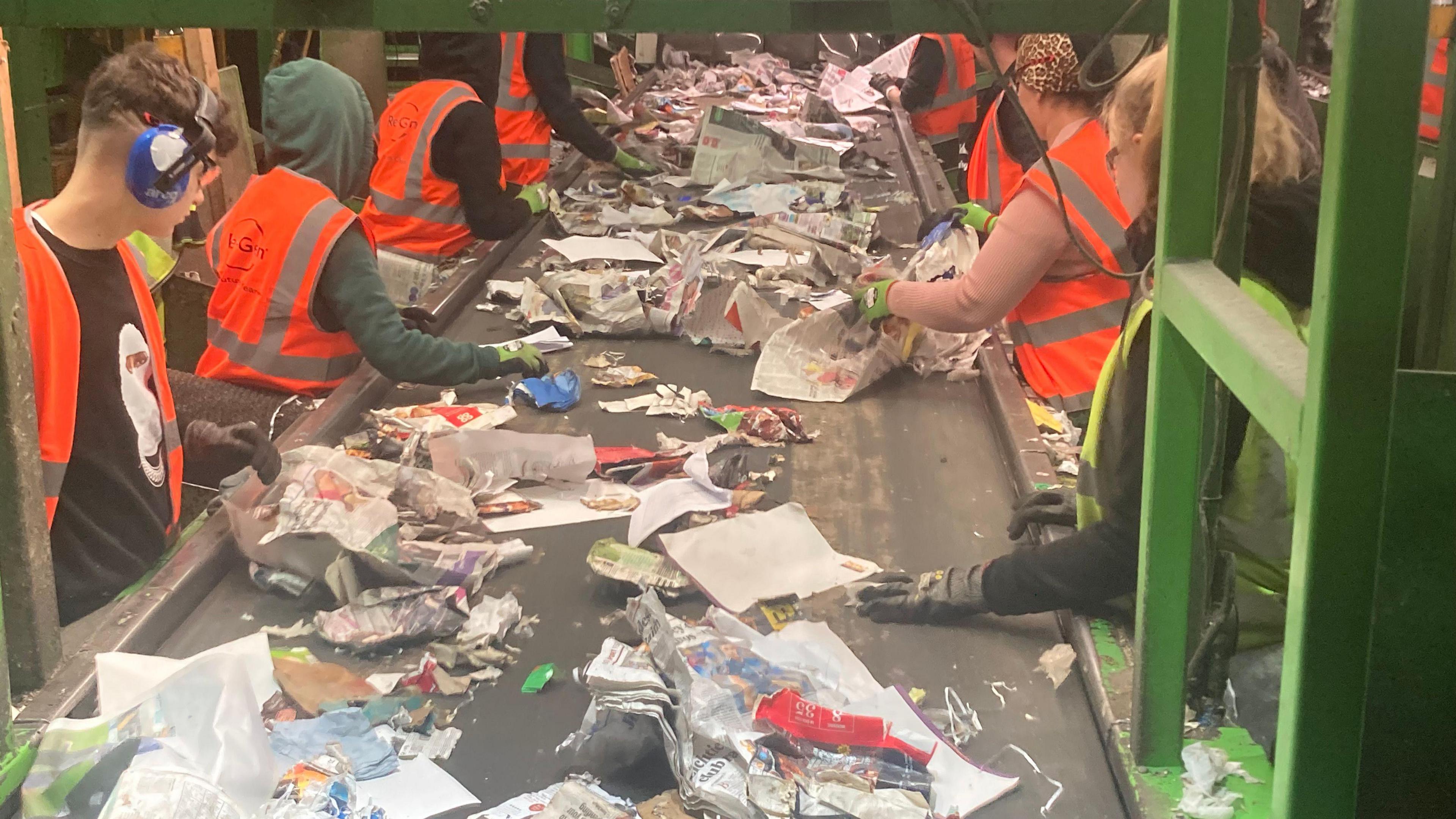 Workers at Re Gen sifting through waste for recycling