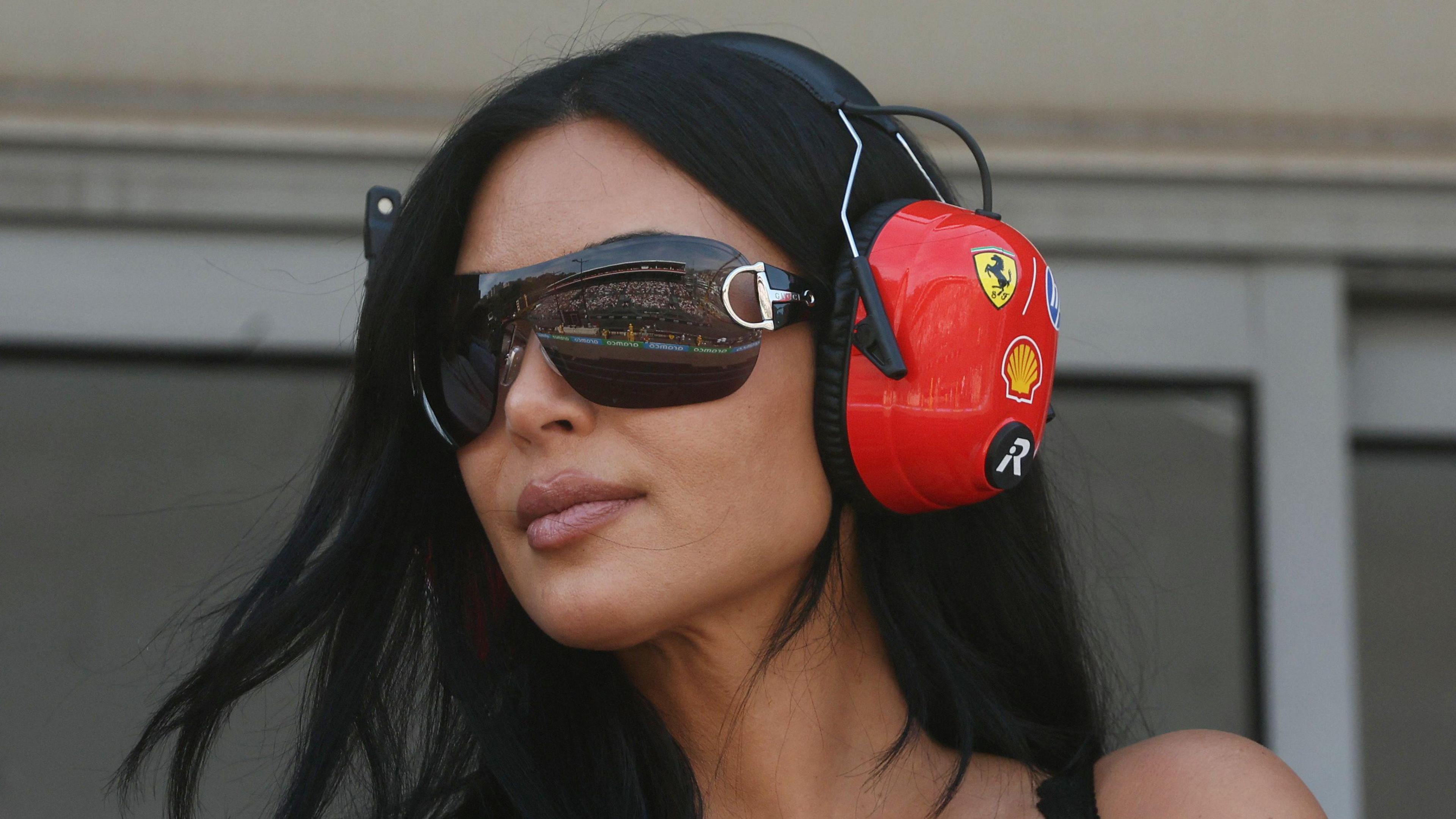 TV Personality Kim Kardashian wearing a Ferrari headset watching the Monaco Grand Prix