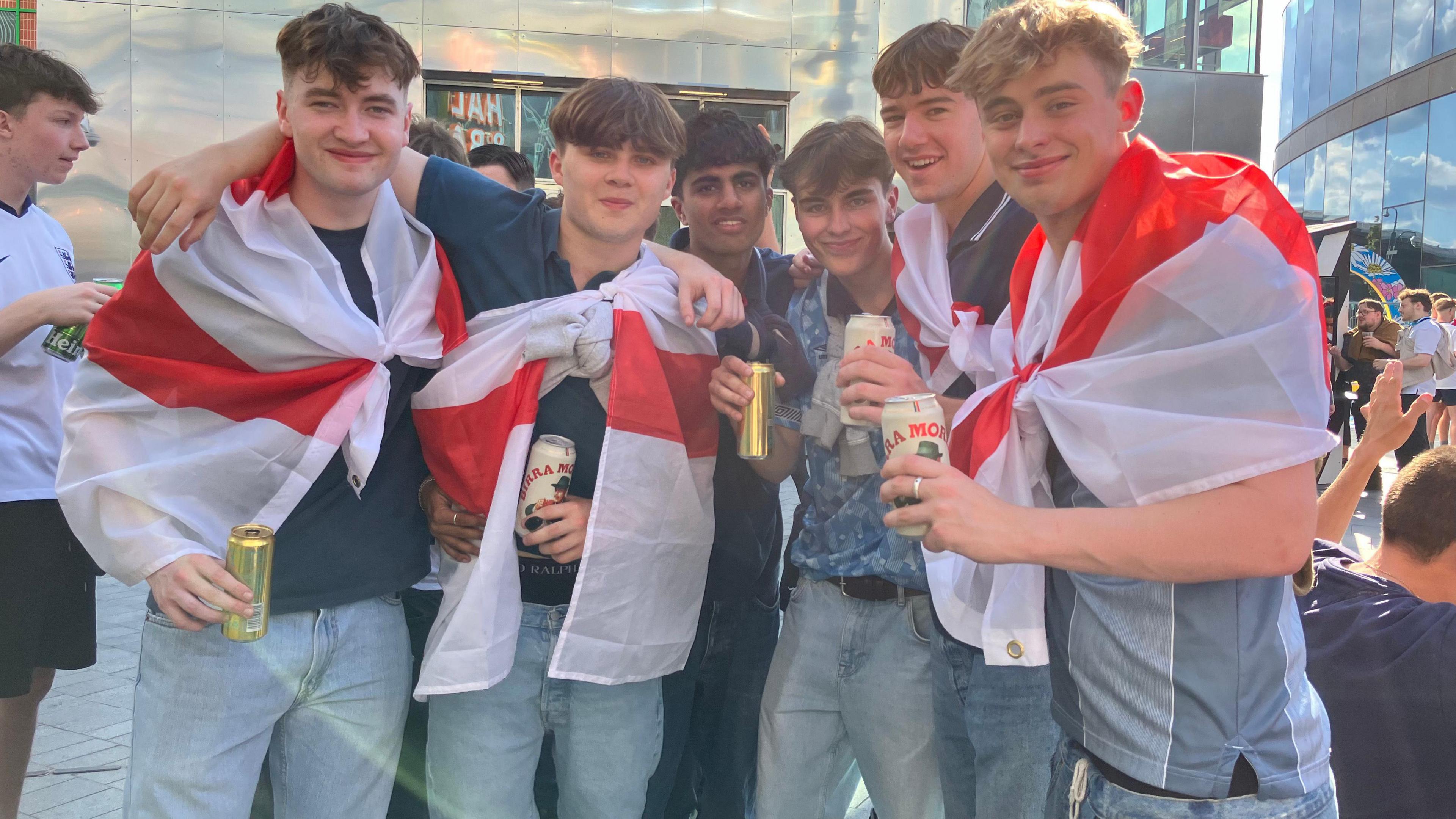 Group of five England fans posing for picture