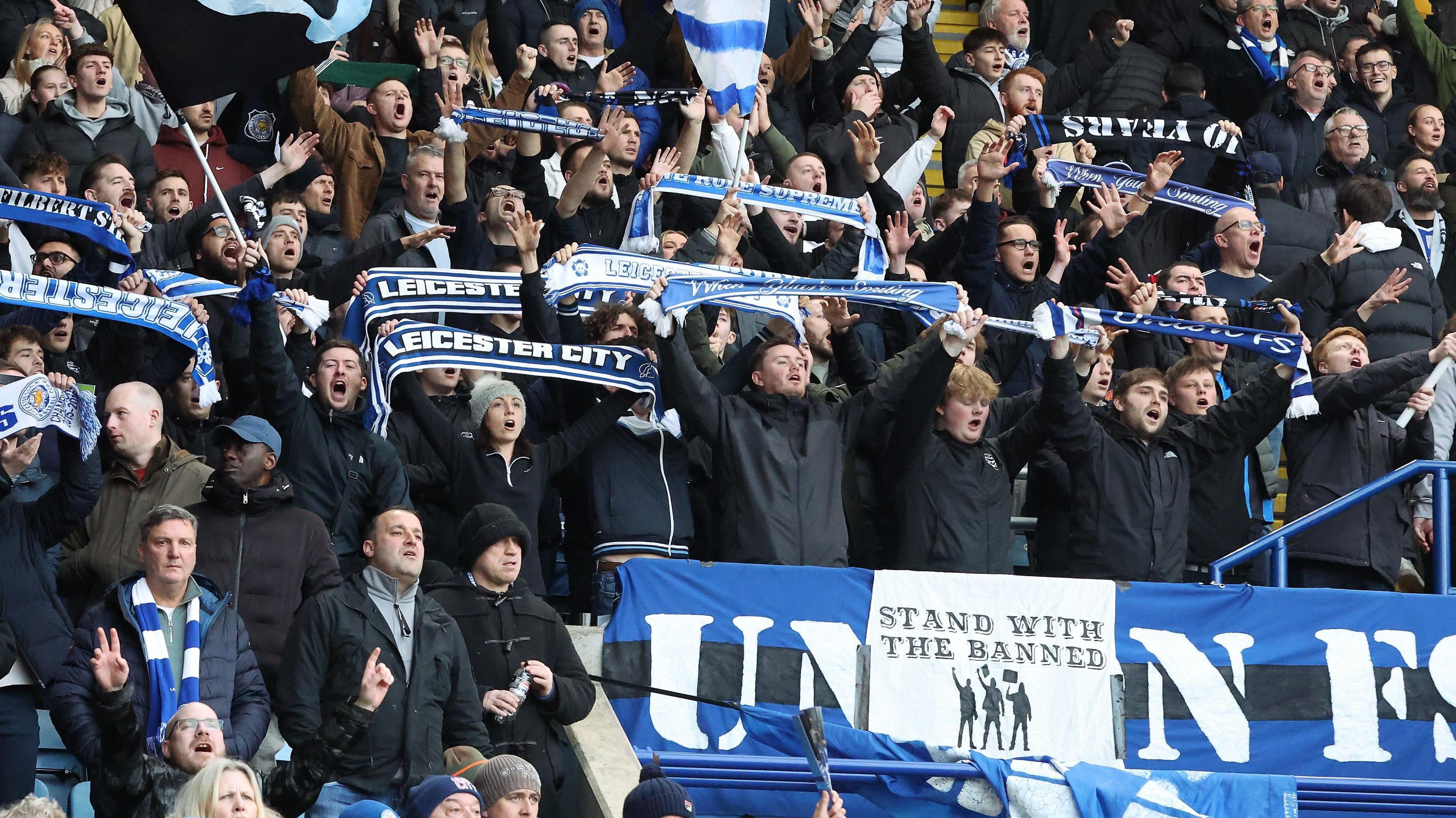 Leicester fans watching their side play.