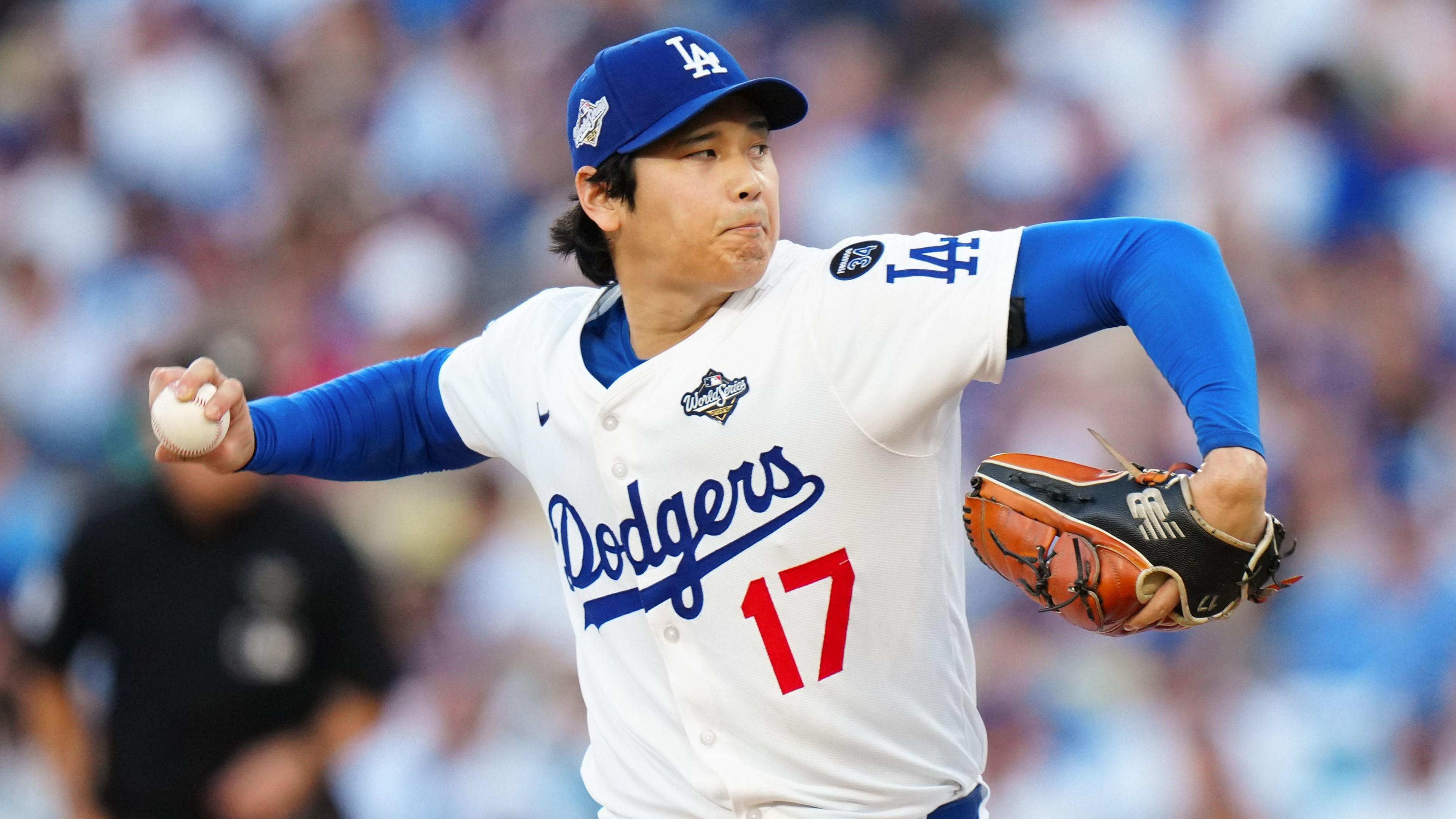 Los Angeles Dodgers pitcher Shohei Ohtani prepares to throw a pitch