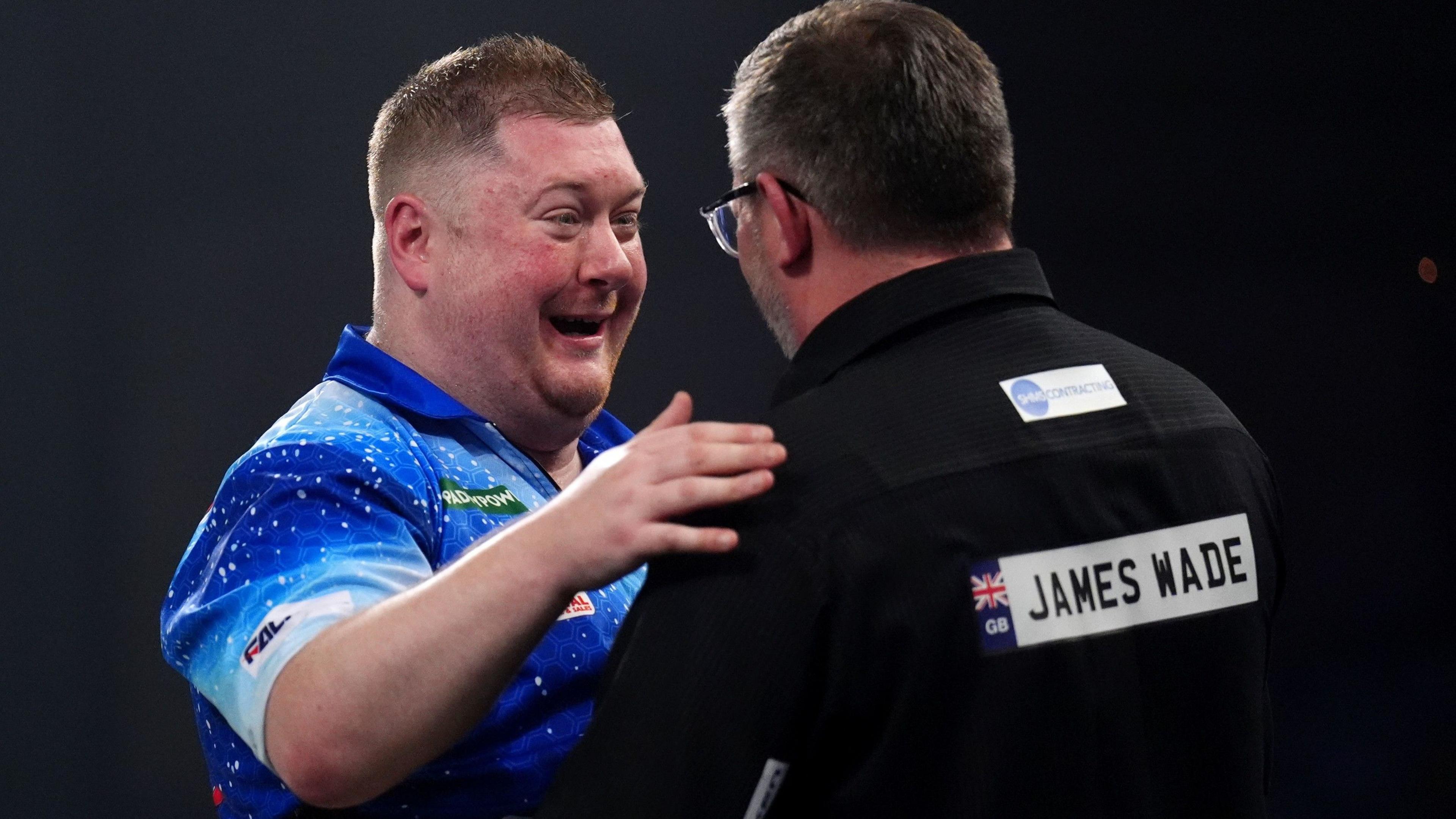 Ricky Evans embraces James Wade