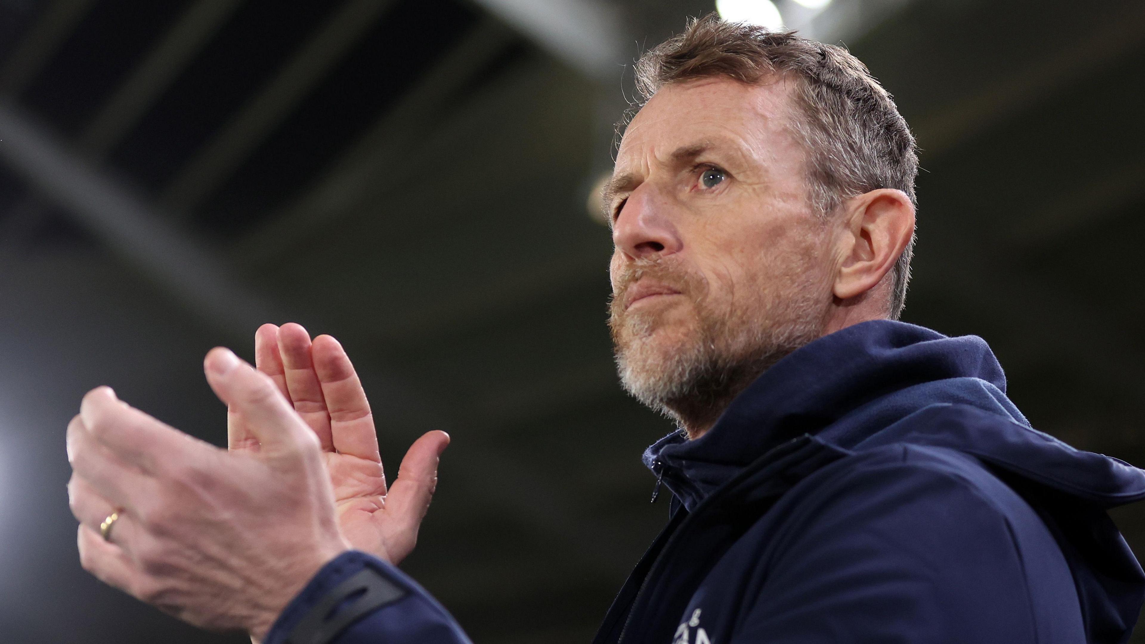 A close-up of Oxford United boss Gary Rowett applauding
