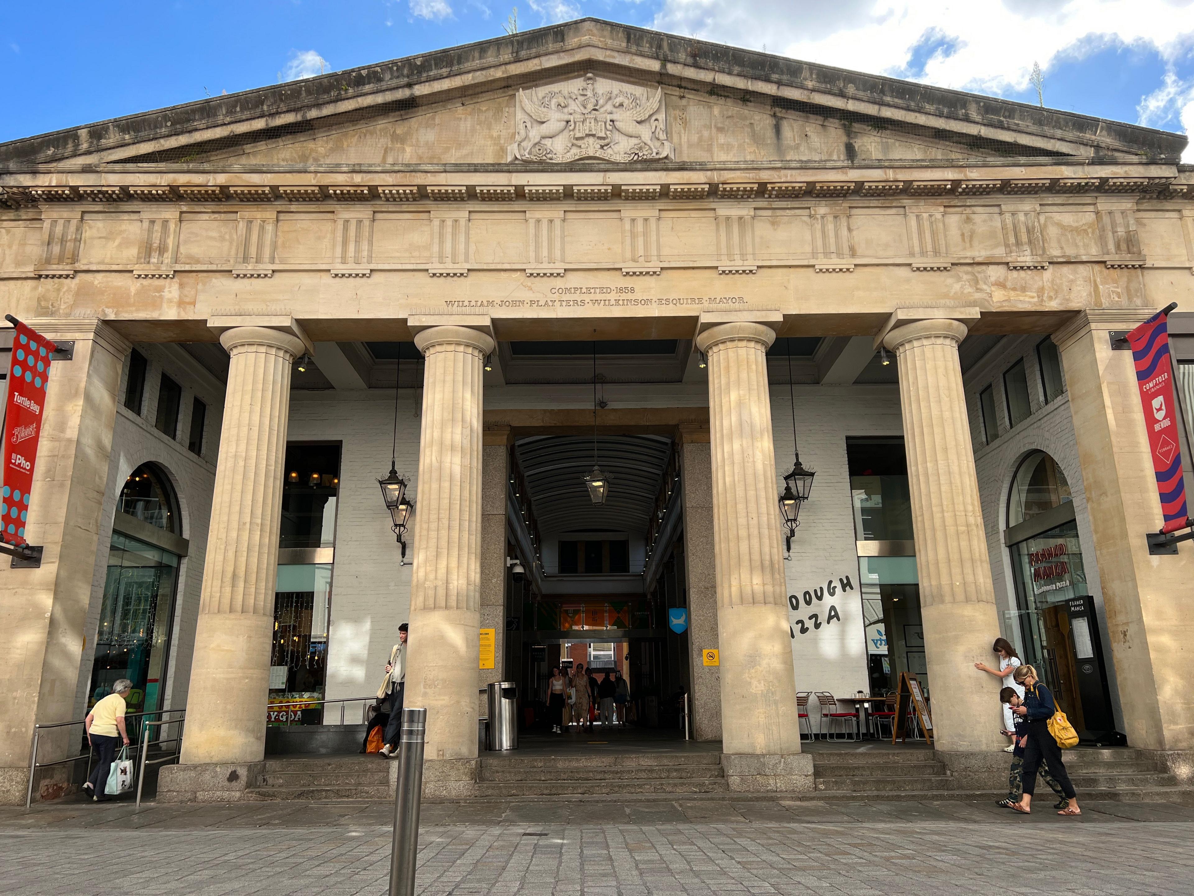 The entrance to the Guildhall shopping centre through large stone columns