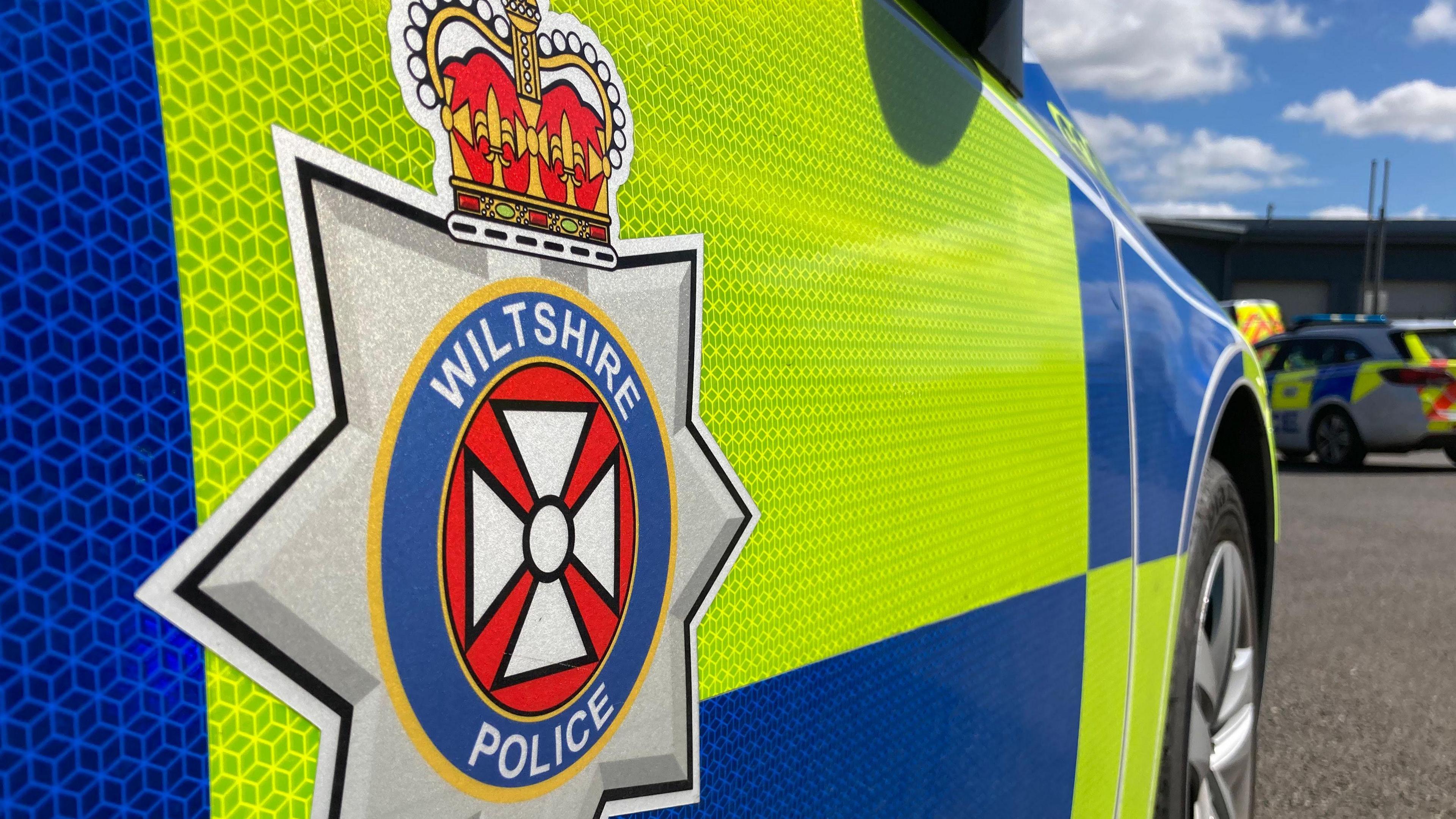 A generic look at a the side of a Wiltshire Police car close-up, showing the logo