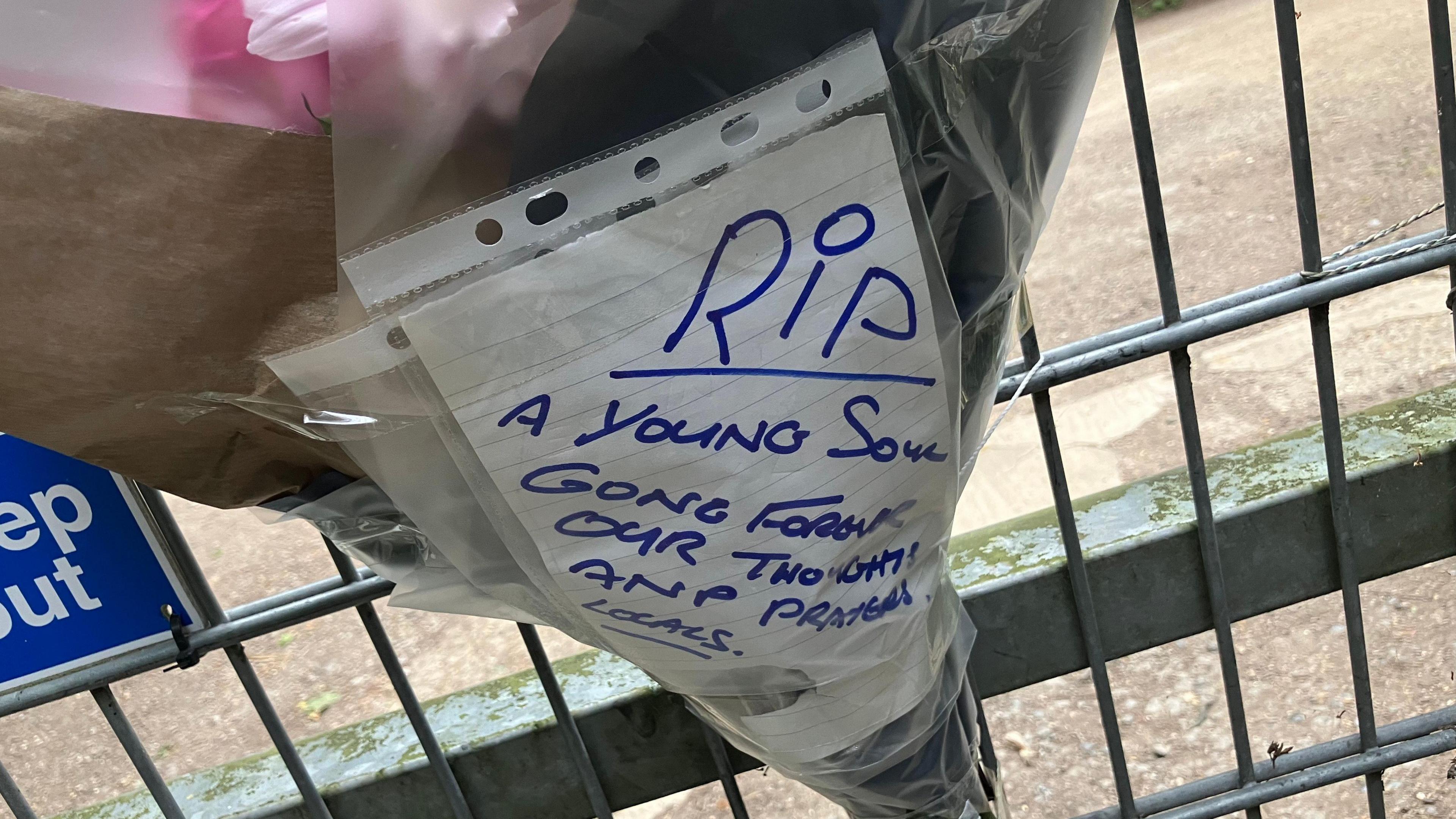 One of the floral tributes at the lakes that had a message attached