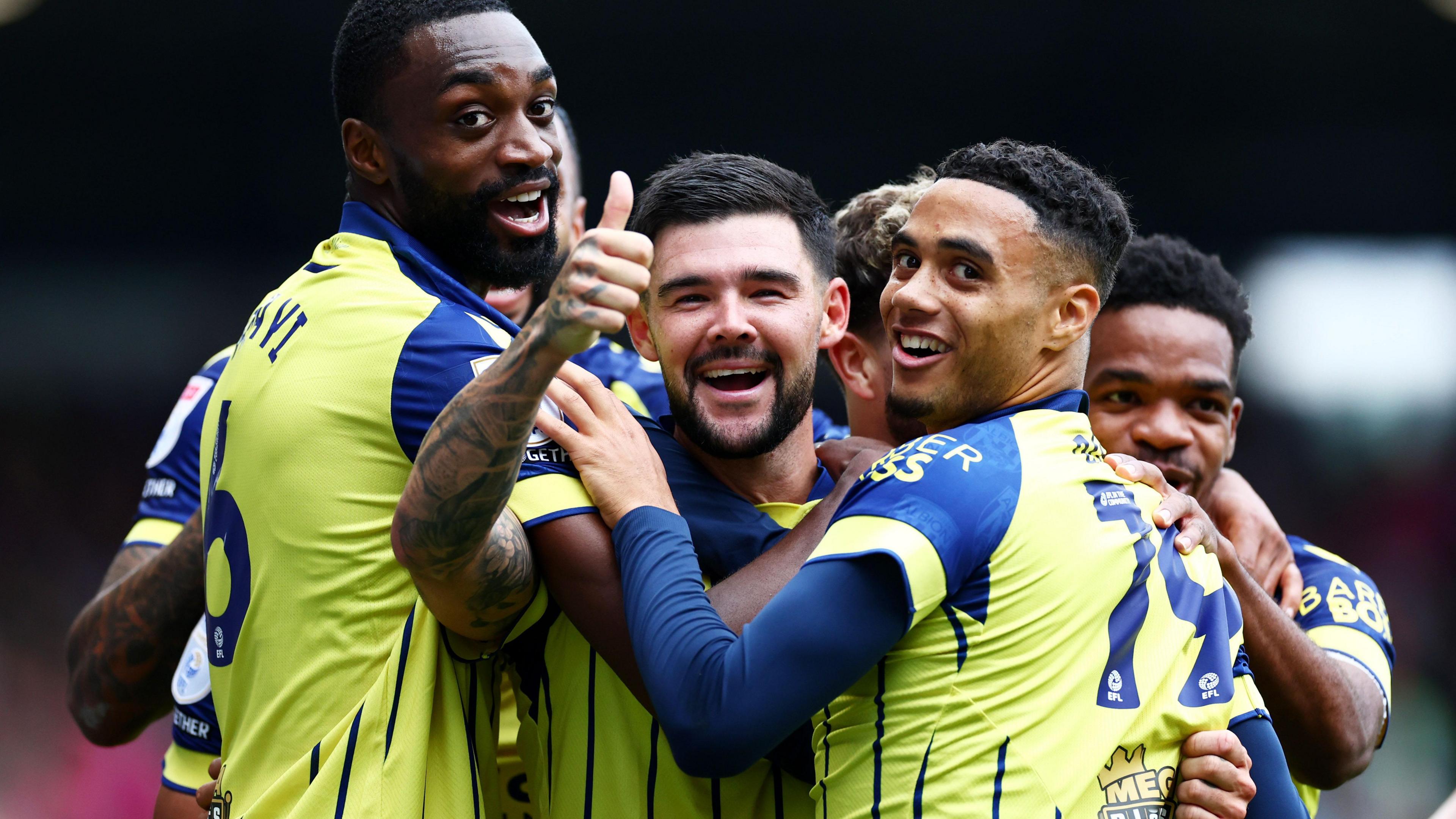 Alex Mowatt celebrates with his West Bromwich Albion team-mates after scoring a goal