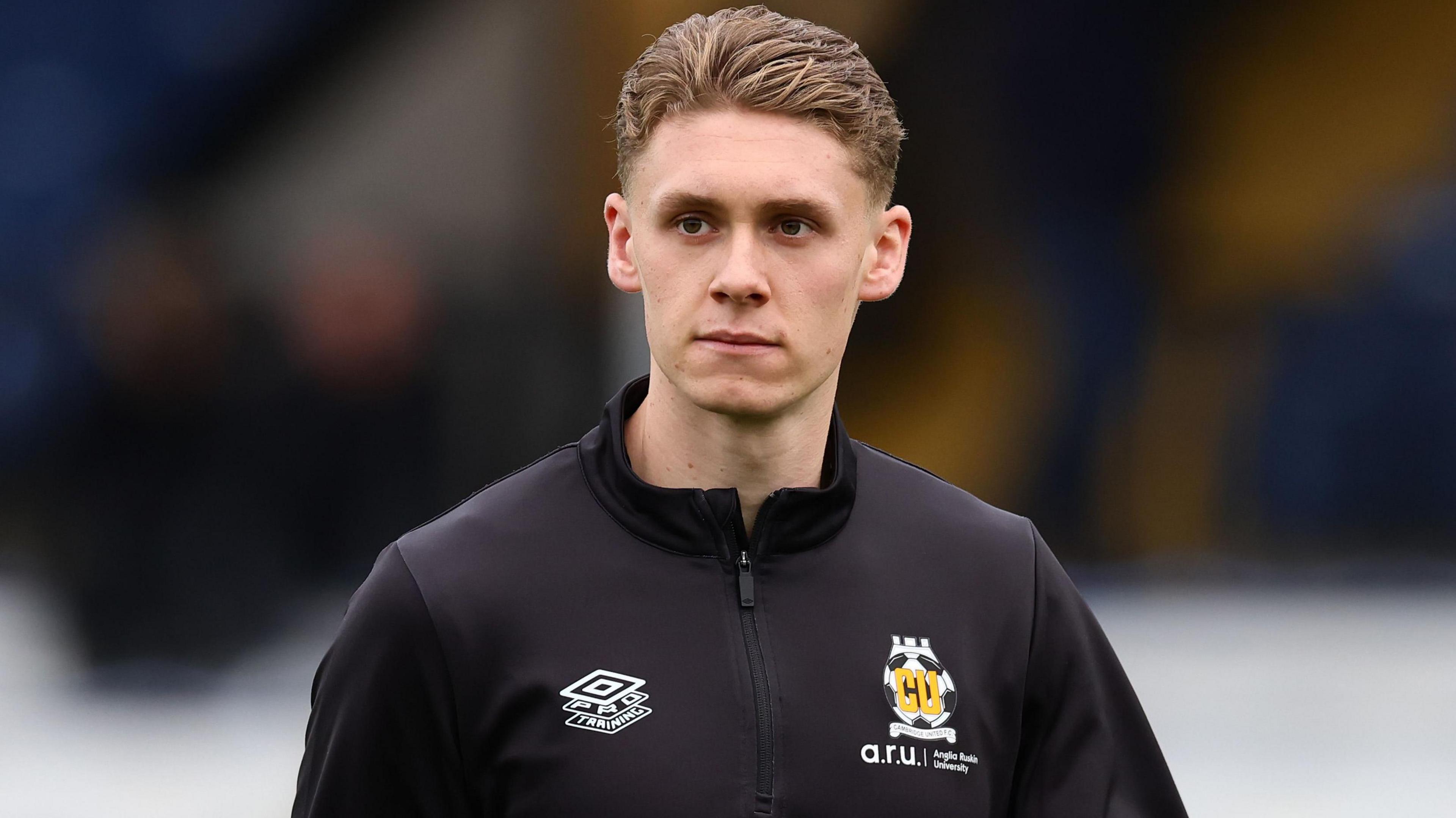 Connor O'Riordan warming up before a game during a loan spell with Cambridge United