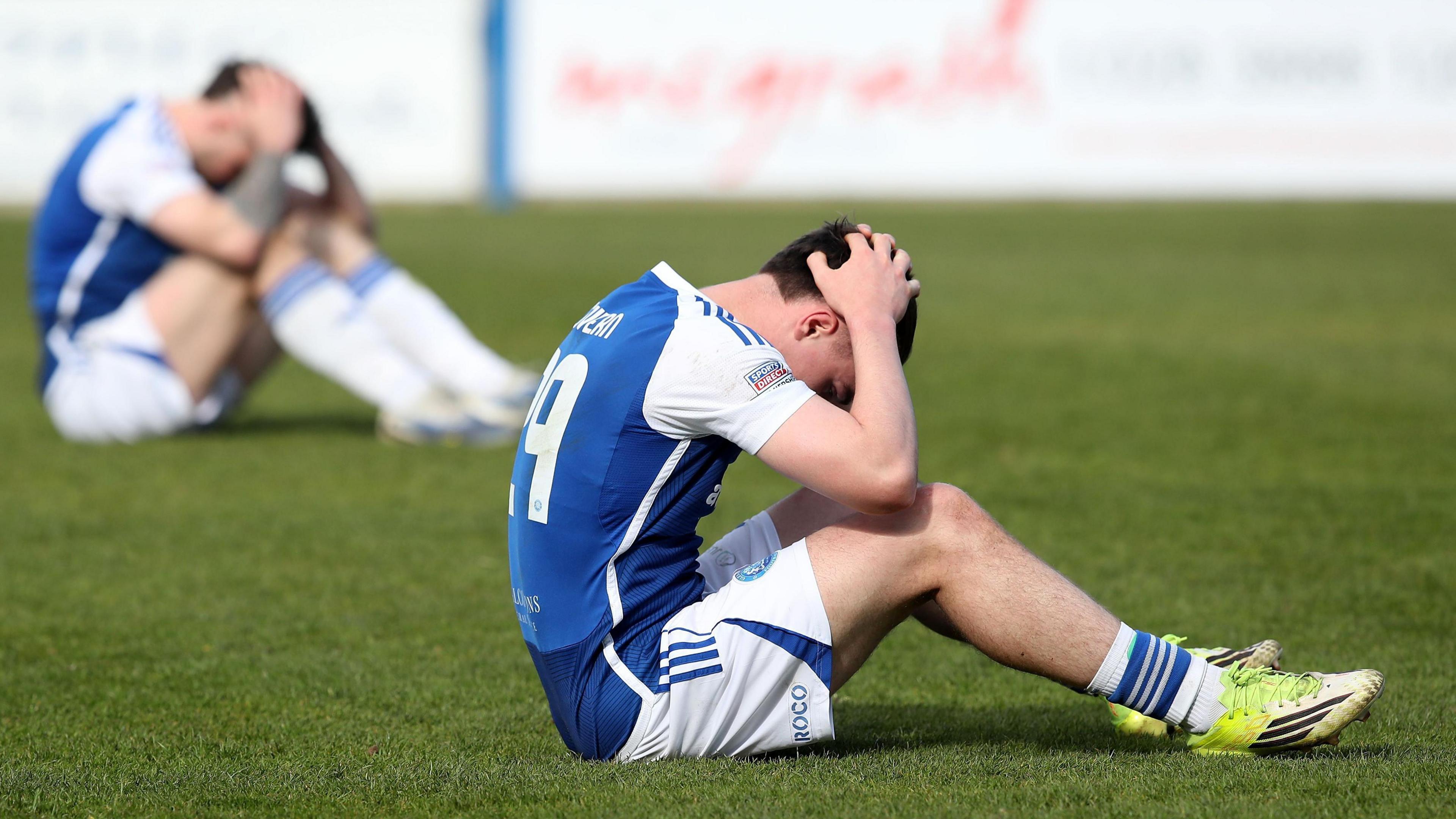 Paul McGovern with his head in his hands 