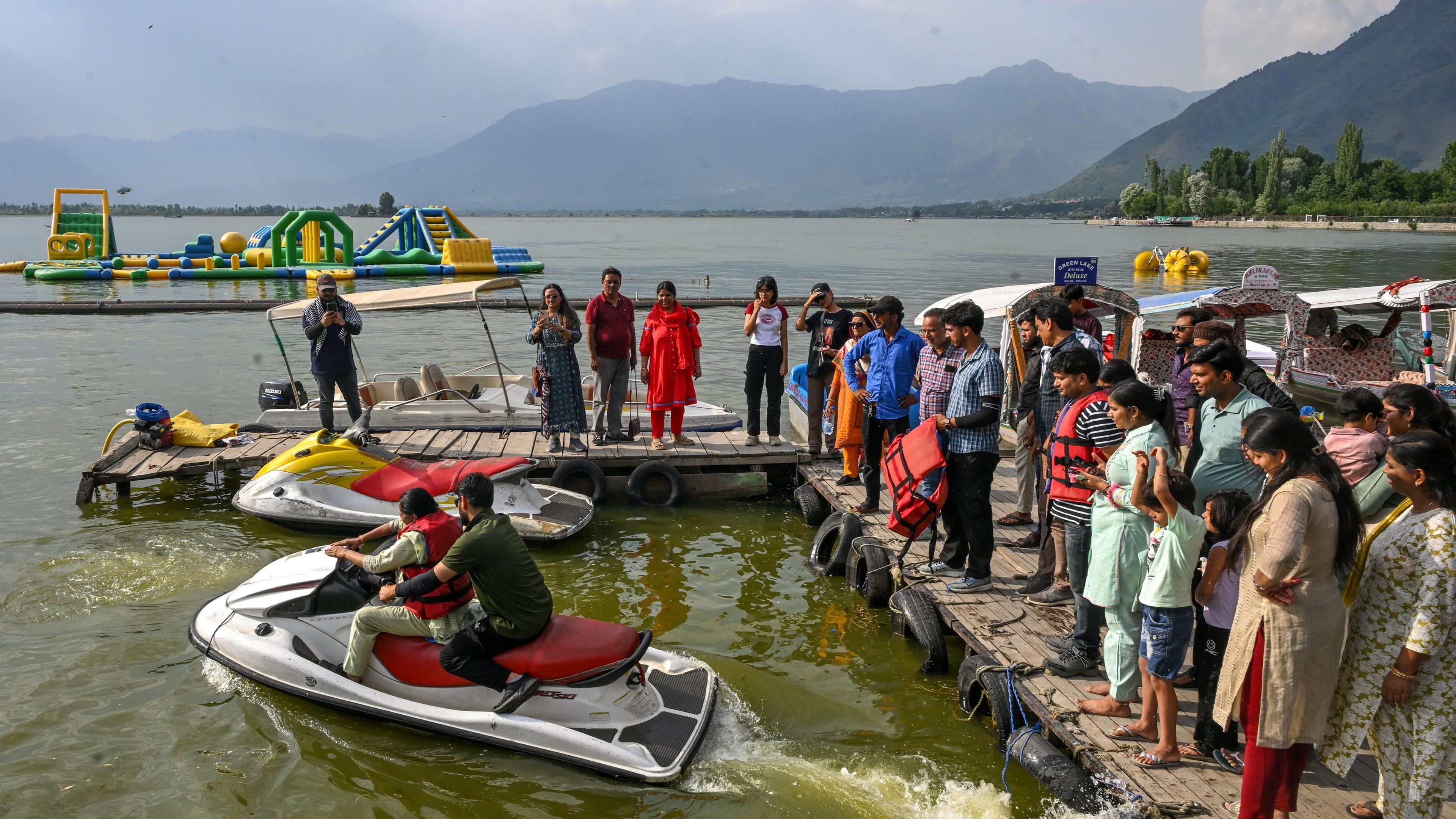 Shabana Awwal makes a video of a relative riding a water bike in Dal Lake
