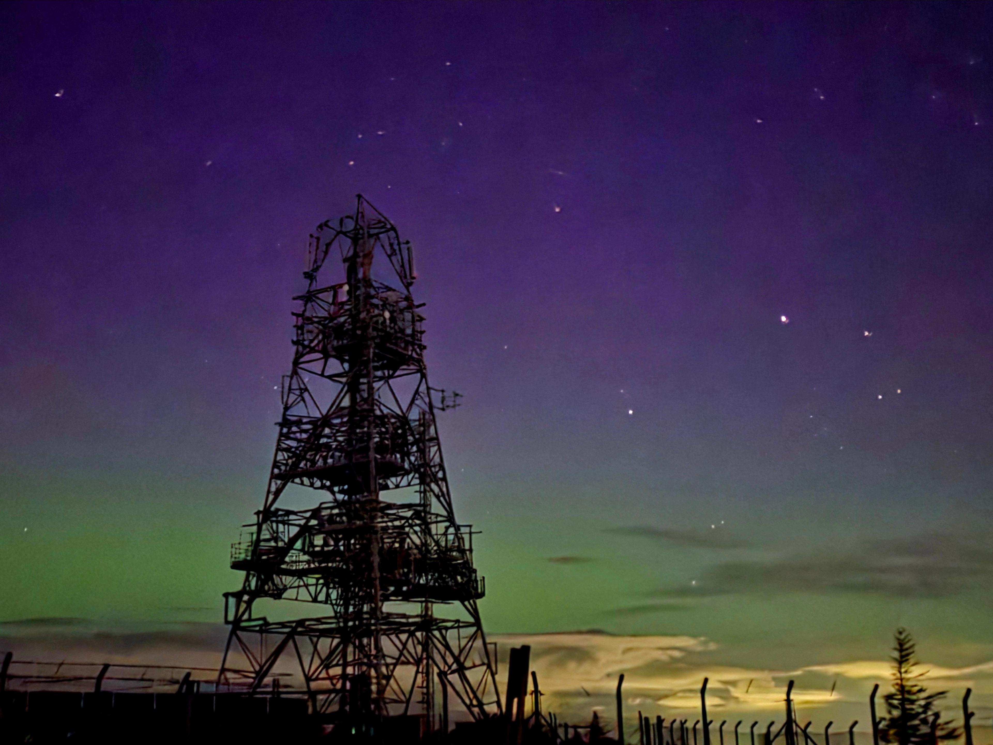 Sharon in Glenrothes took this image of a pylon in front of a deep purple sky. A fence is also seen running along the bottom of the picture.