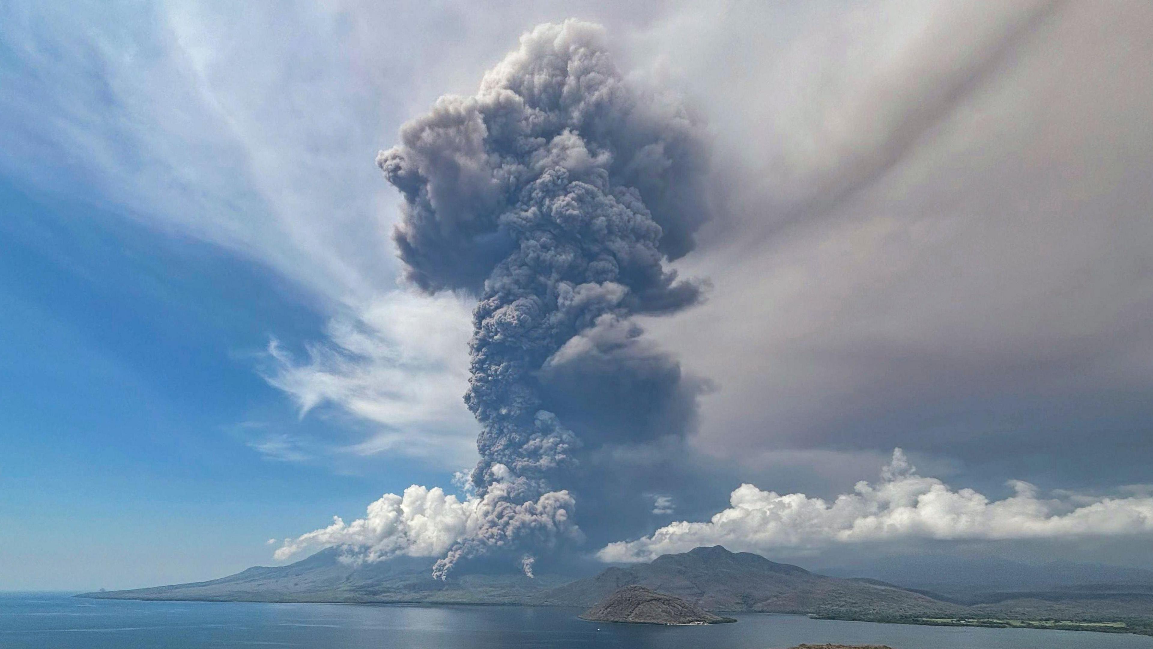 A handout photo made available by the National Board for Disaster Management (BNPB) shows the Lewotobi Laki-Laki volcano spewing volcanic materials during an eruption as seen from Titihena, East Flores, East Nusa Tenggara province, Indonesia, 09 November 2024. 