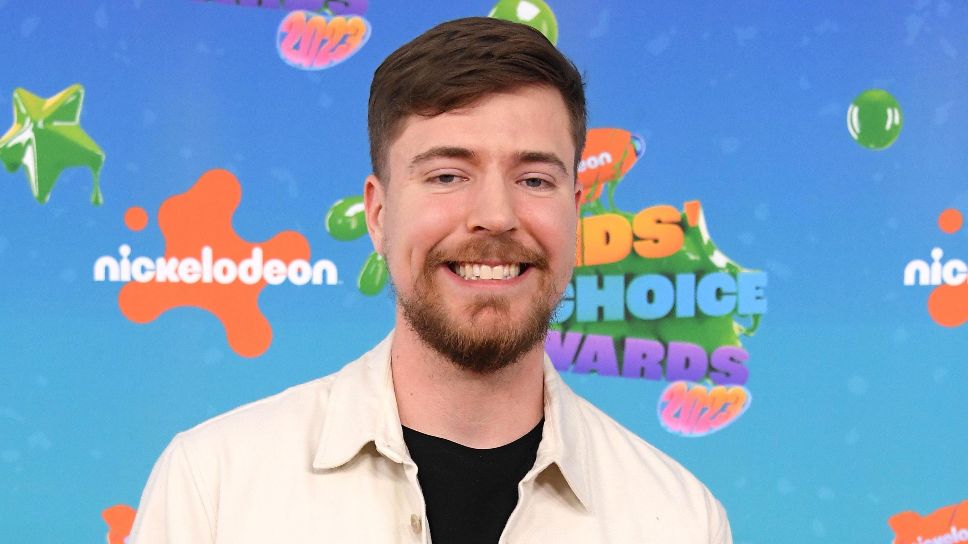 MrBeast pictured at Nickelodeon's 2023 Kids' Choice Awards wearing a cream overshirt over a black top. 