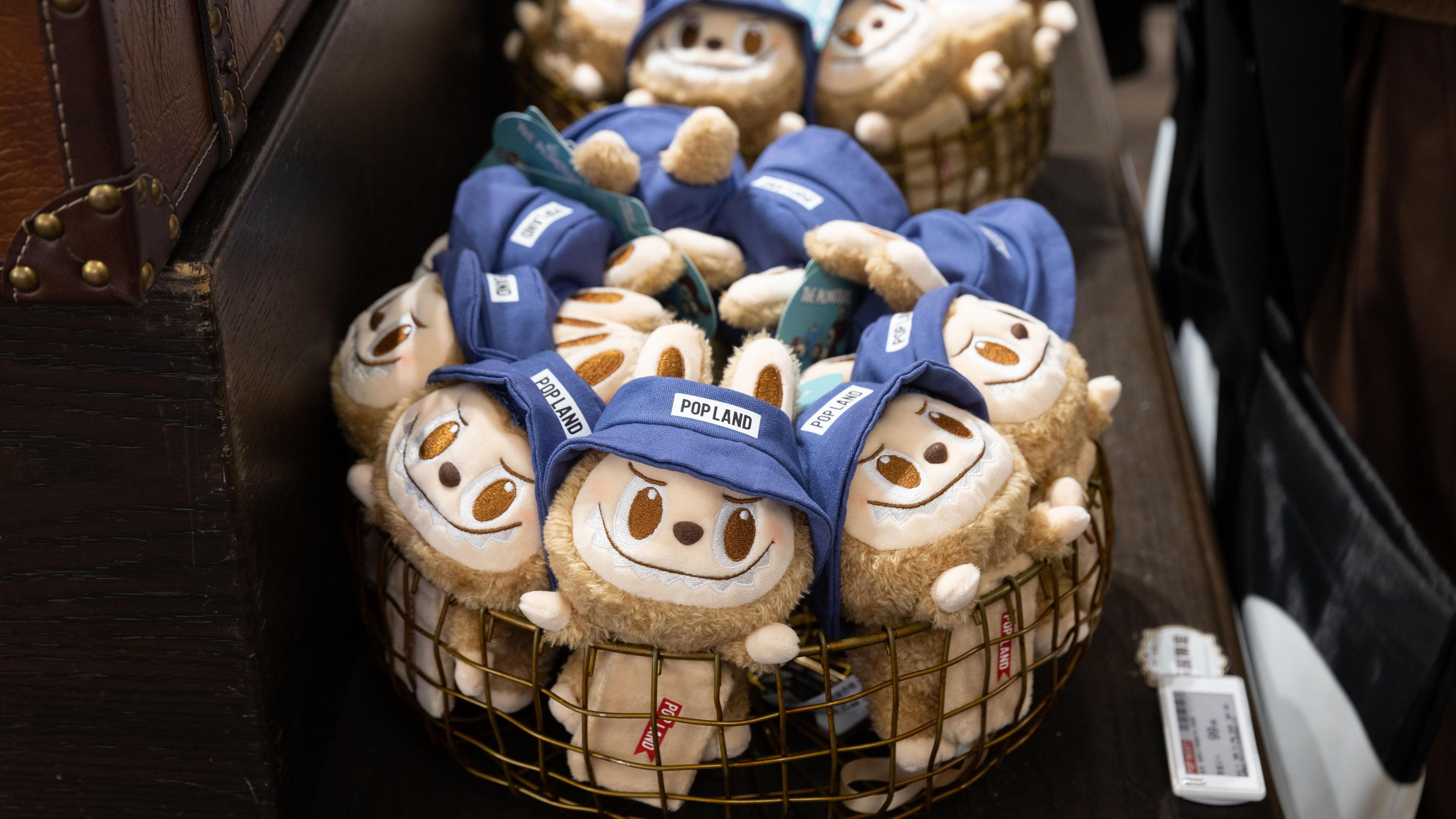 A basket filled with Labubu toys - plush toys of monster elves