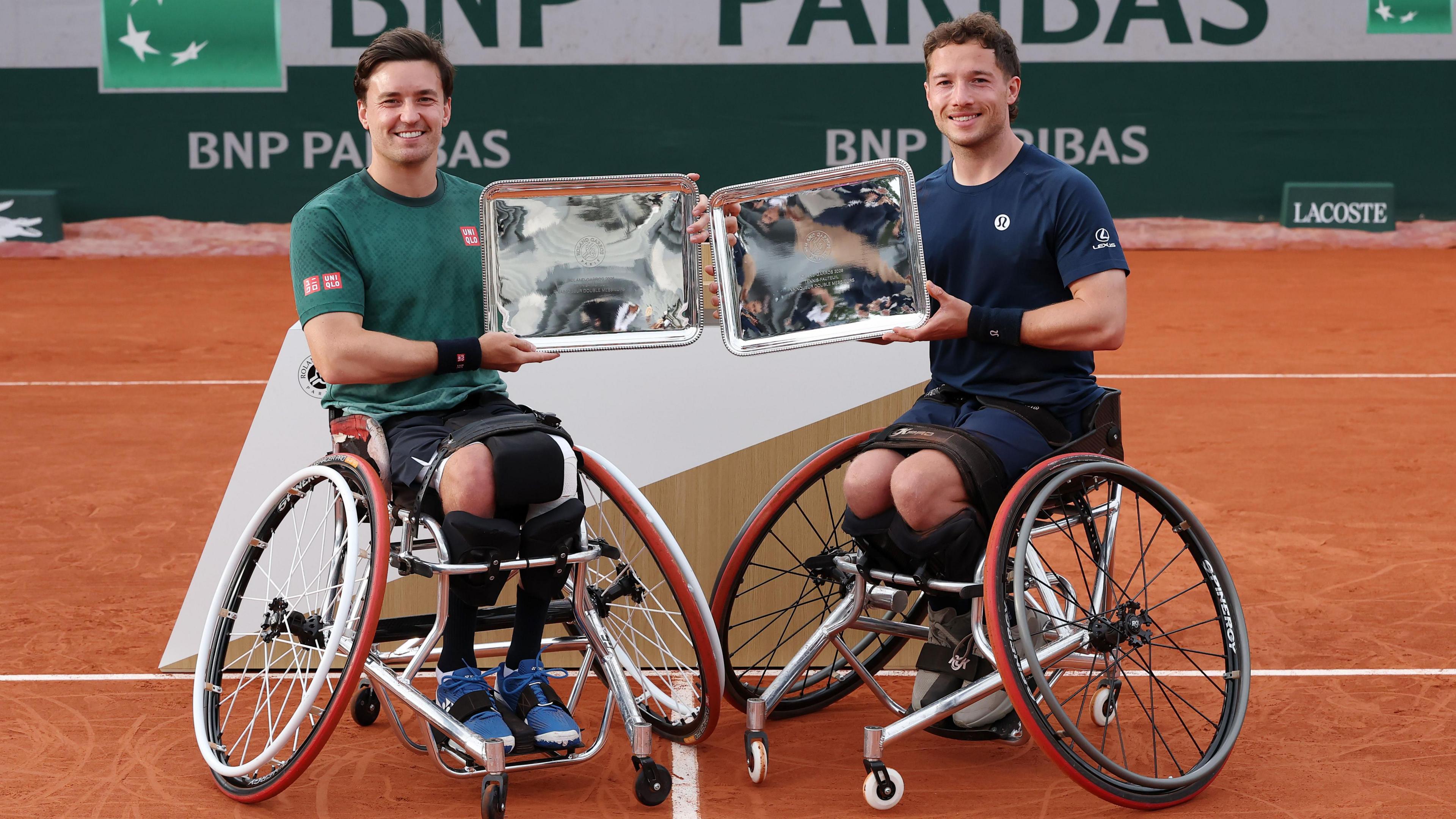 Gordon Reid of Great Britain and Alfie Hewett of Great Britain pose for a photo with their Men's Wheelchair Doubles Trophies
