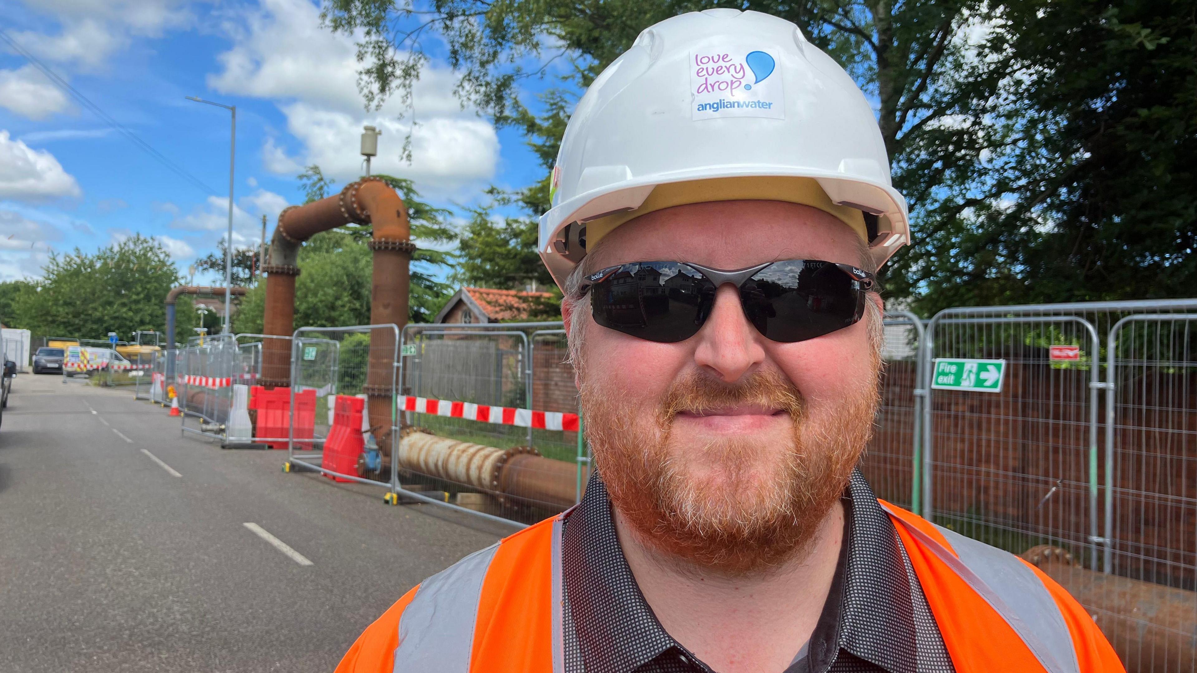 Lee Forth standing in front of the pipework