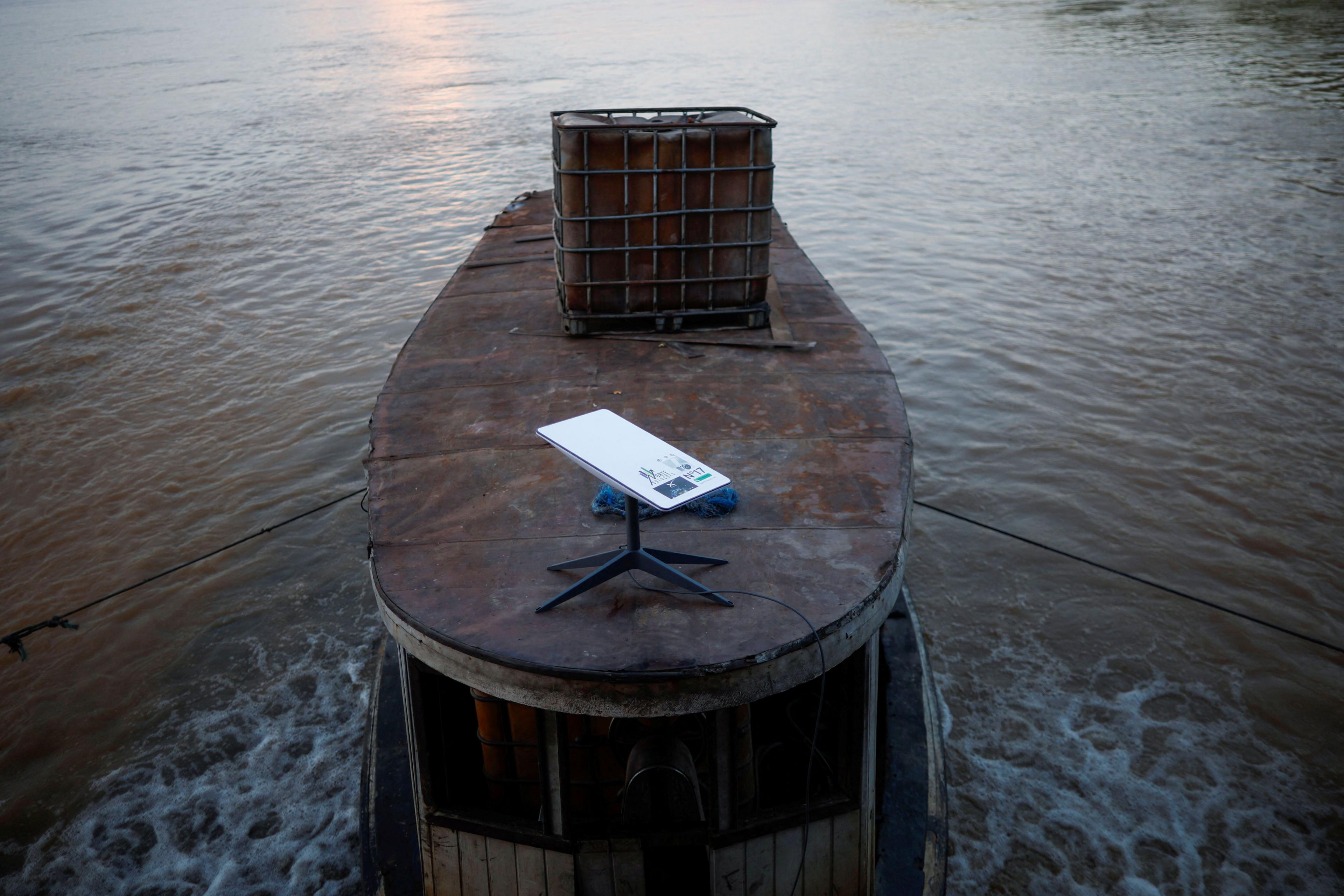 A Starlink satellite internet system set up on a miners' boat on the Madeira River in Porto Velho, Rondonia state, Brazil