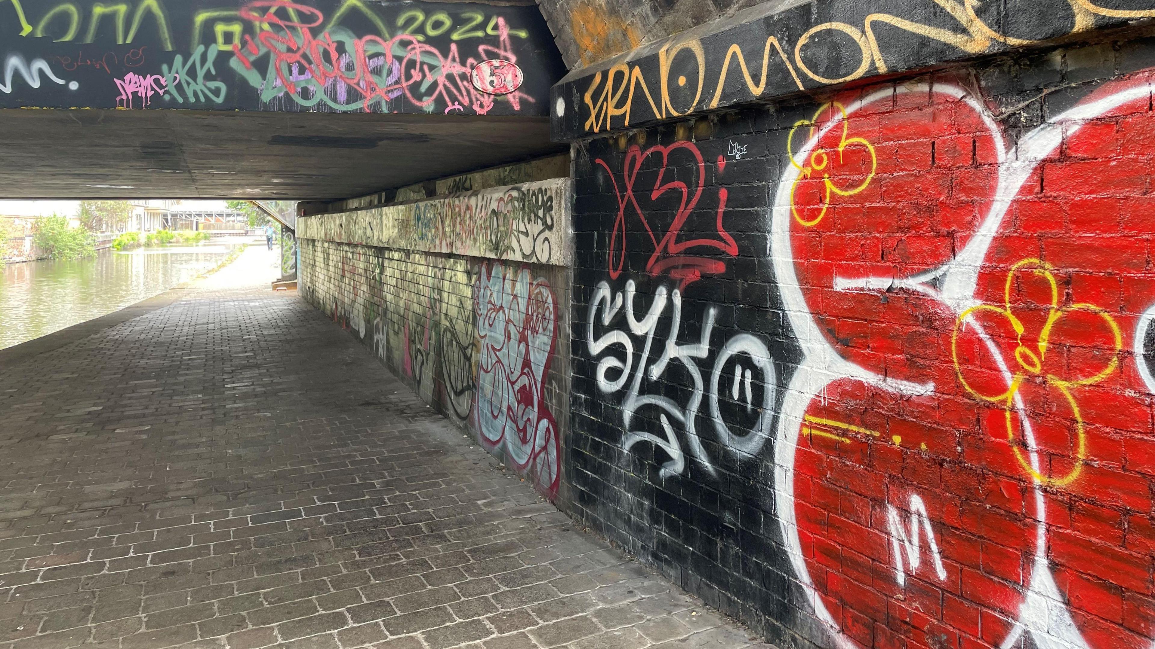 Canal with graffiti scribbled on the walls