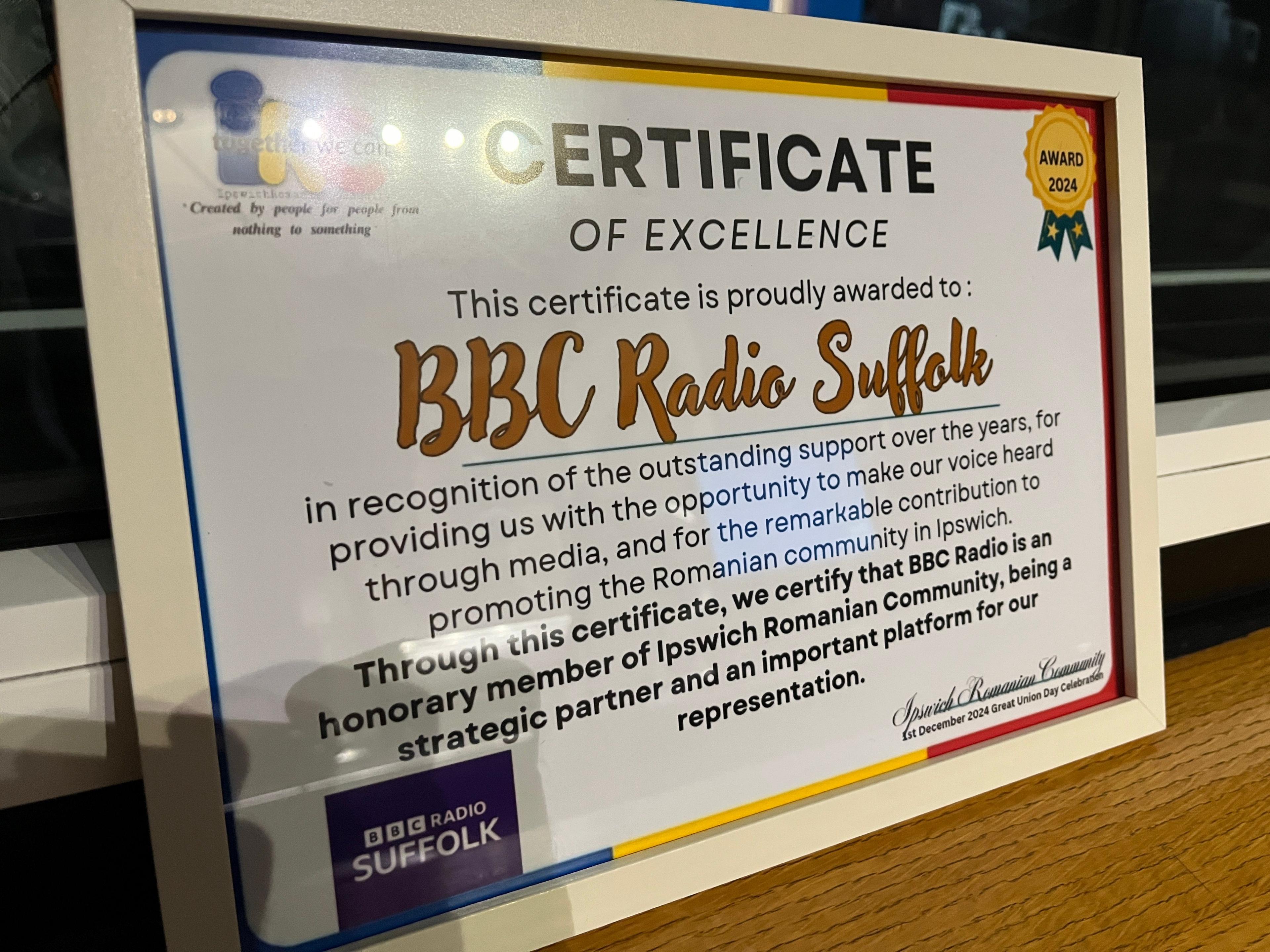 A certificate in a frame, to BBC Radio Suffolk