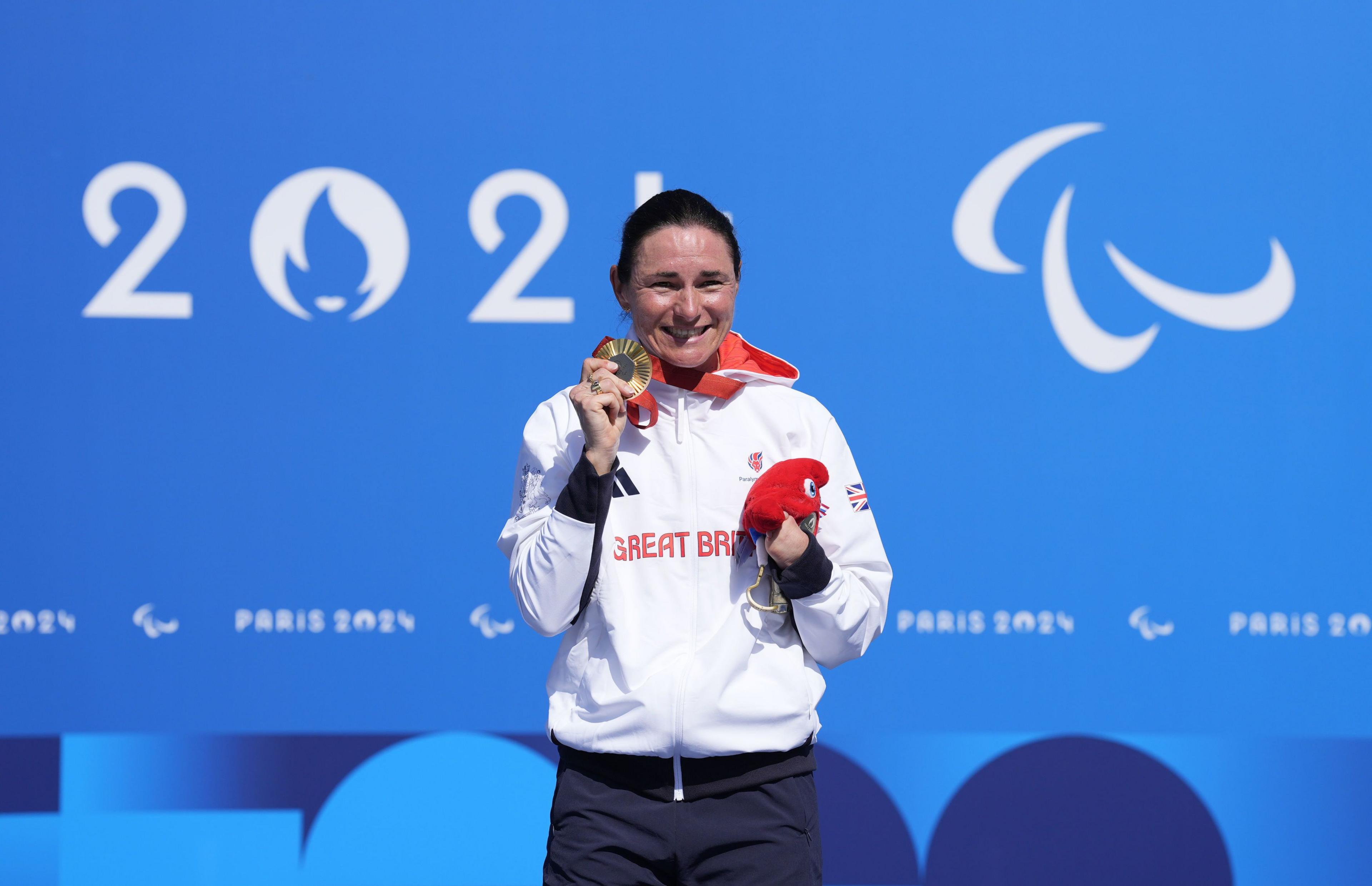 Sarah Storey holds her hold meal at a ceremony in Paris