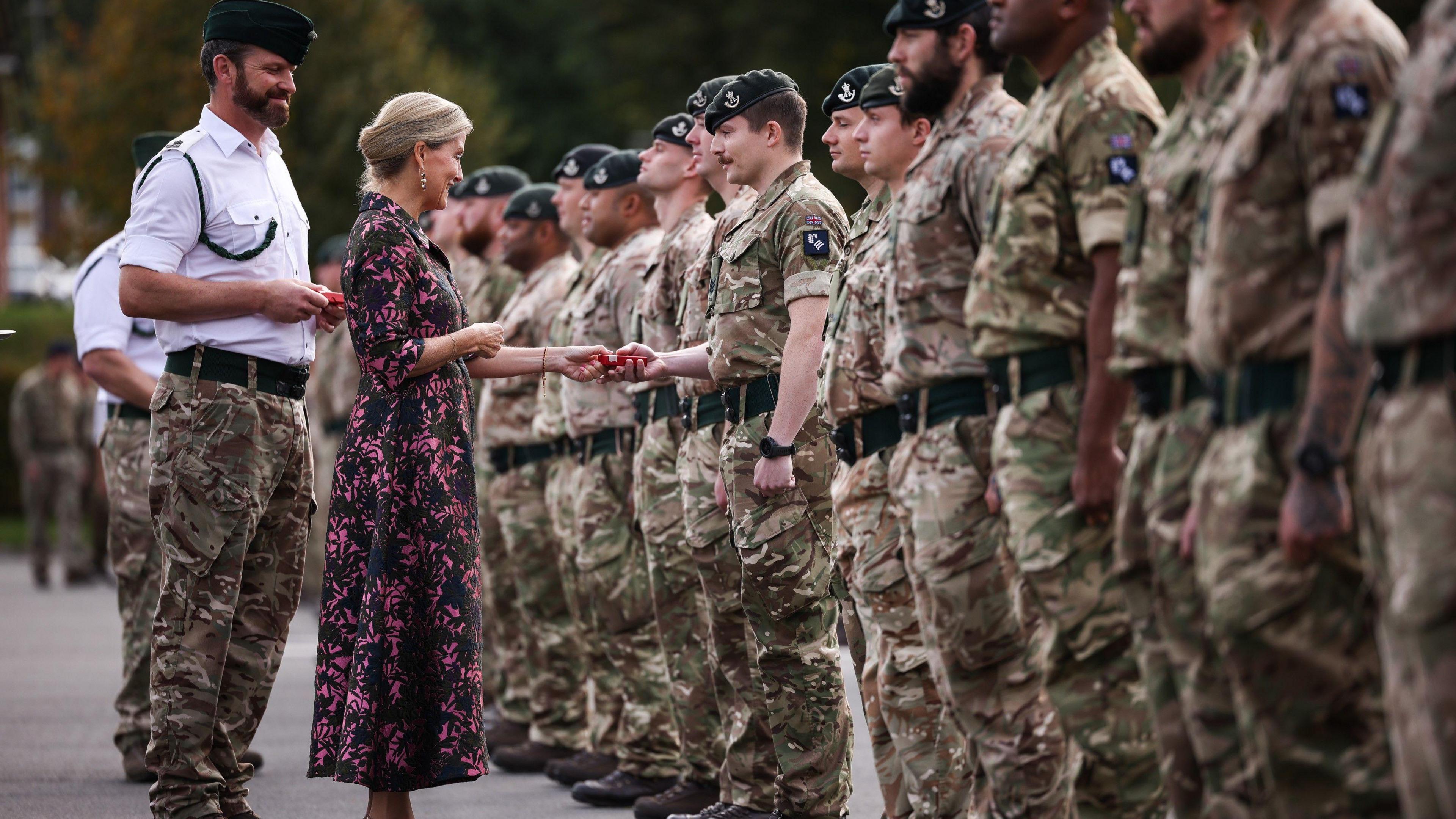 The Duchess of Edinburgh presenting medals to a parade