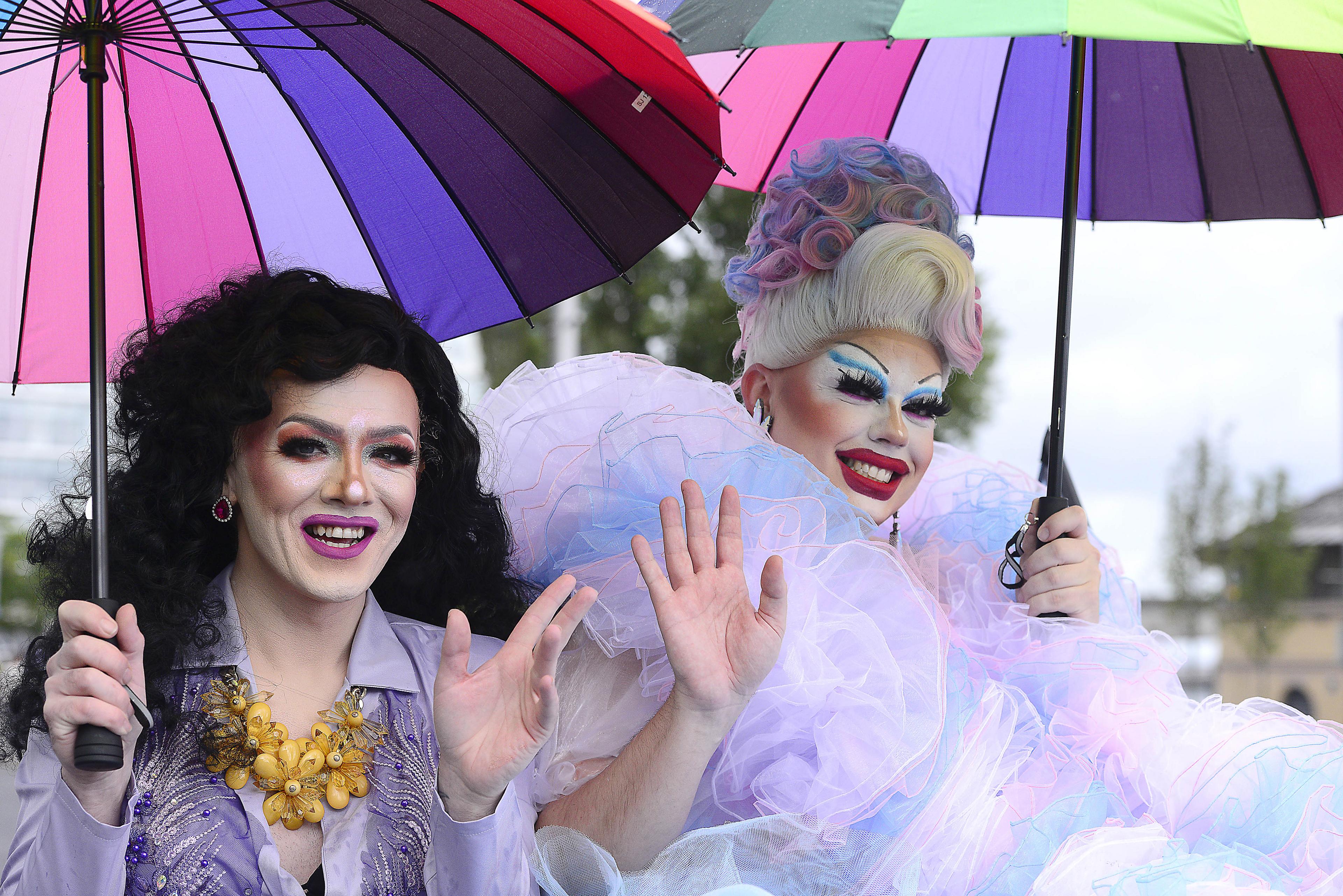 Drag Queens wave to the crowd  