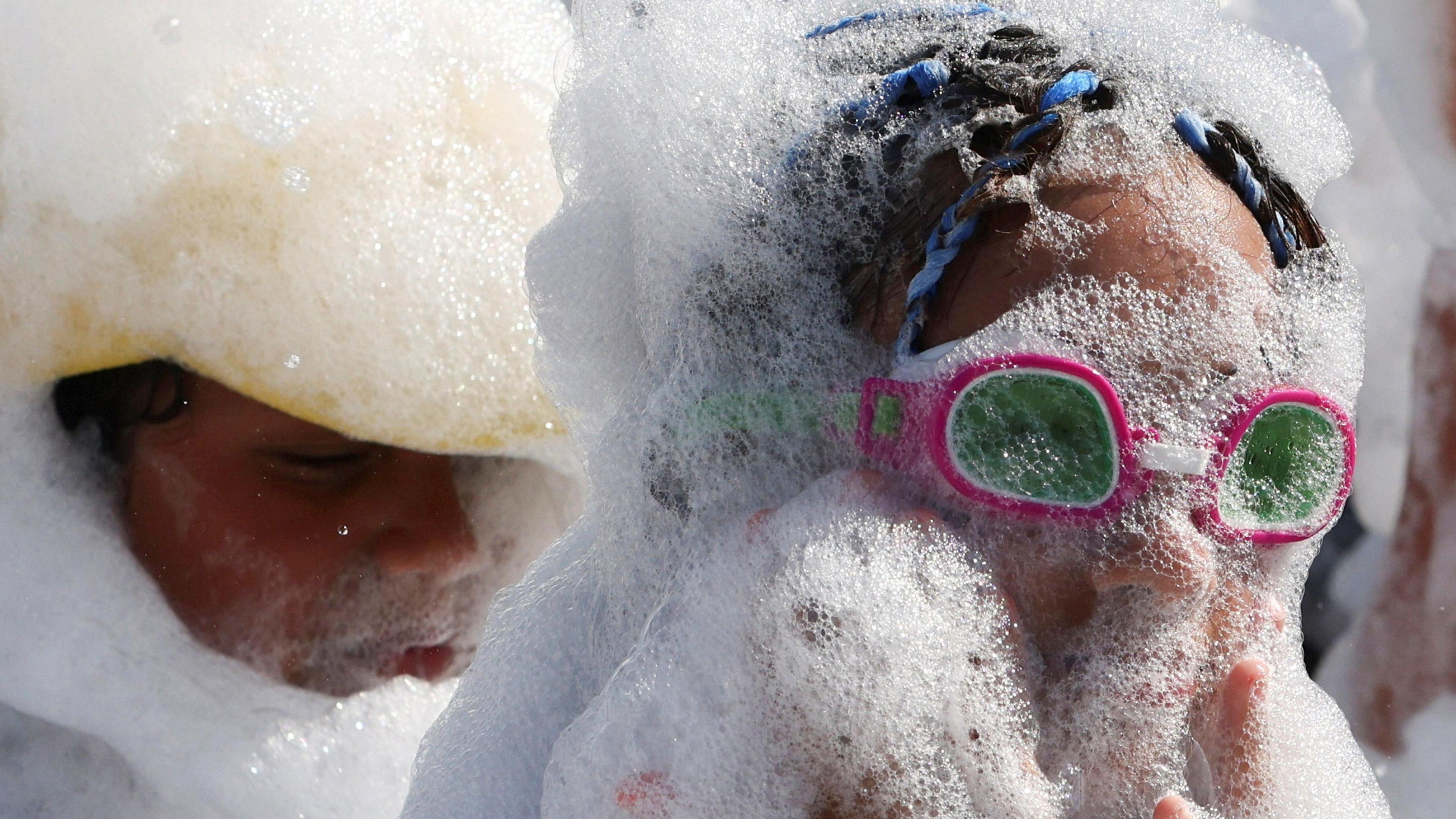 An image of children playing with bubbles amid a heatwave at a Red Sea resort in Hurghada, Egypt July 30, 2024. 