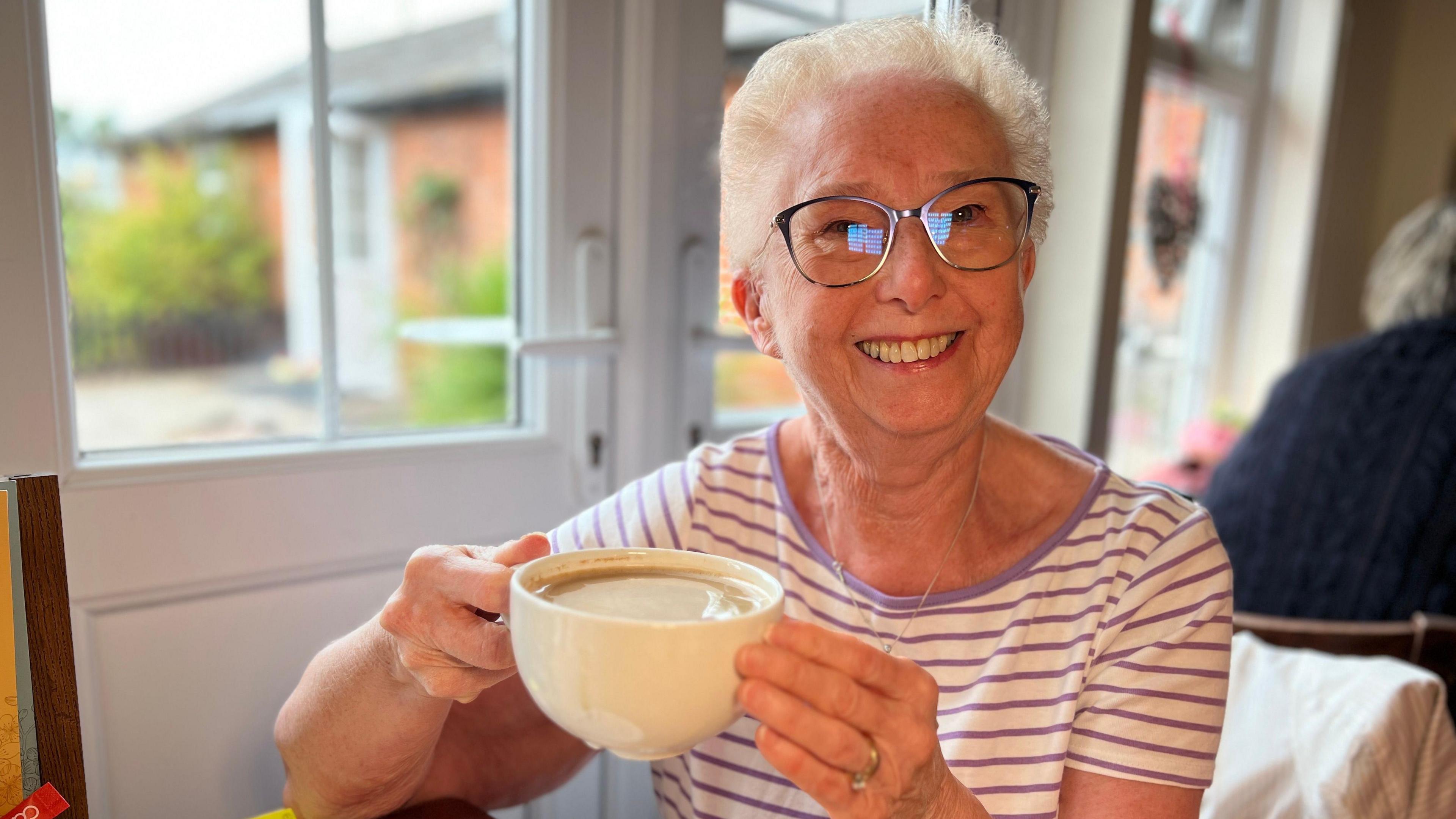 Jan Mason with coffee cup